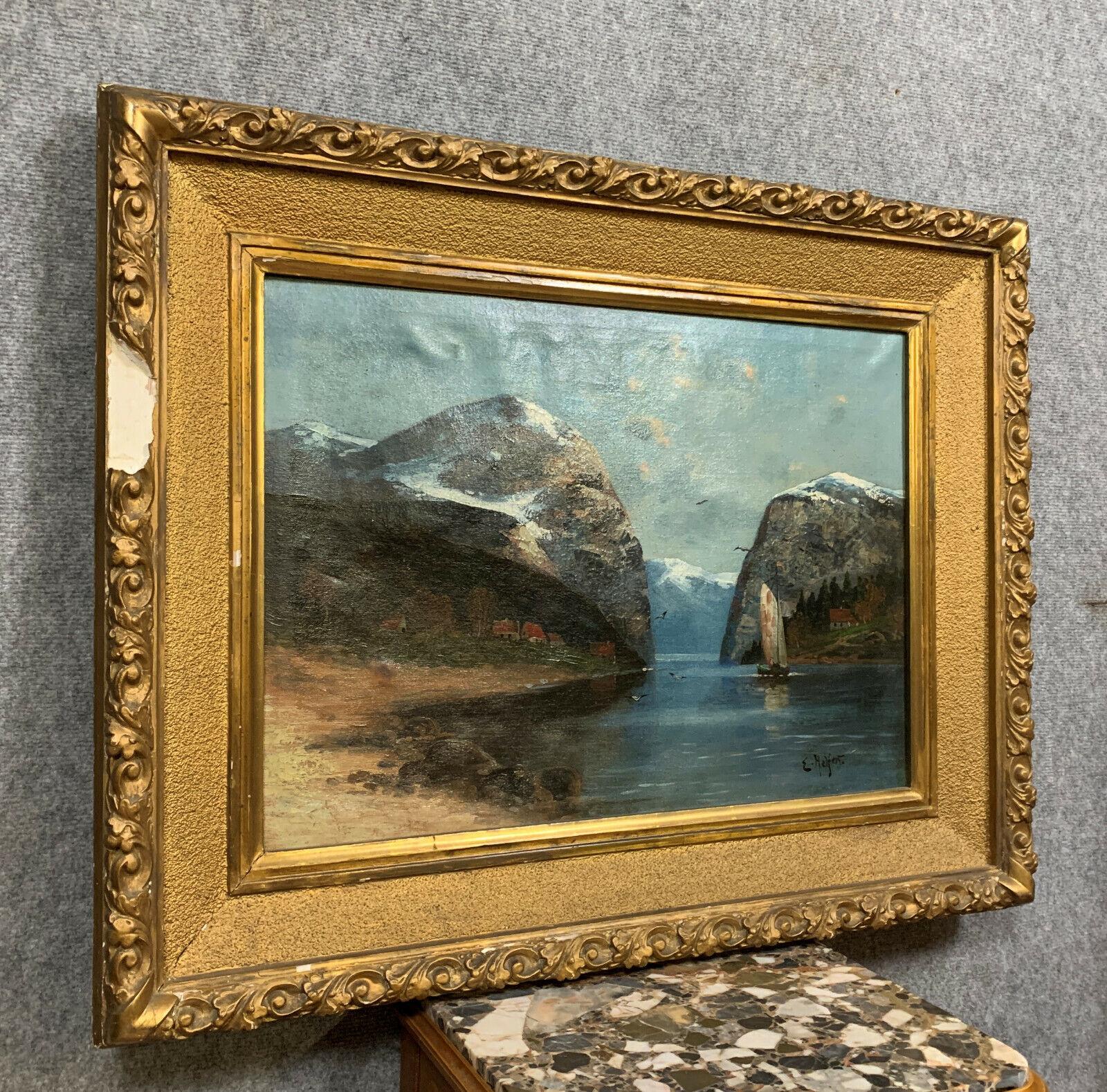 Immerse yourself in the picturesque beauty of nature with this large oil painting by Willy Erik Helfert, dating back to the early 20th century, circa 1920-1940. The painting features a stunning lakeside landscape, with the majestic Alps gracing the