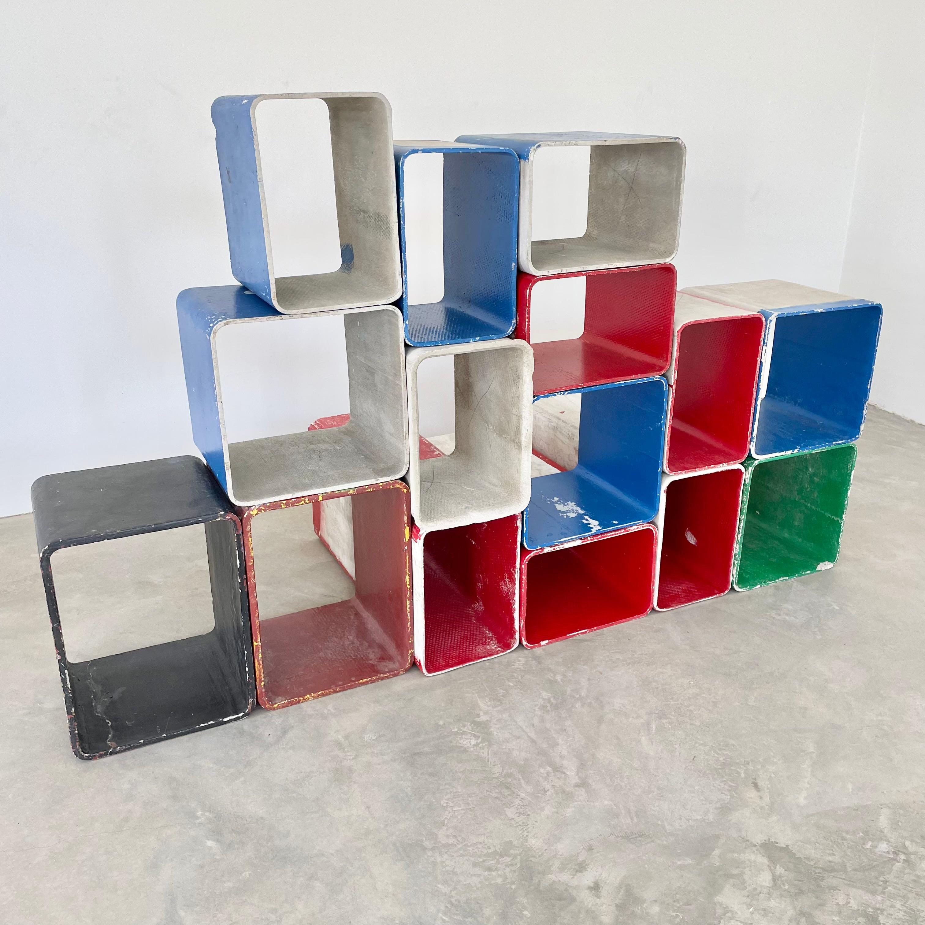 Sculptural set of painted concrete cubes by Swiss architect Willy Guhl. Handmade in the early 1960s in Switzerland. Produced by Eternit. Red, blue, green, white and black coloring. Can be arranged in a multitude of ways. Perfect bookcase, room