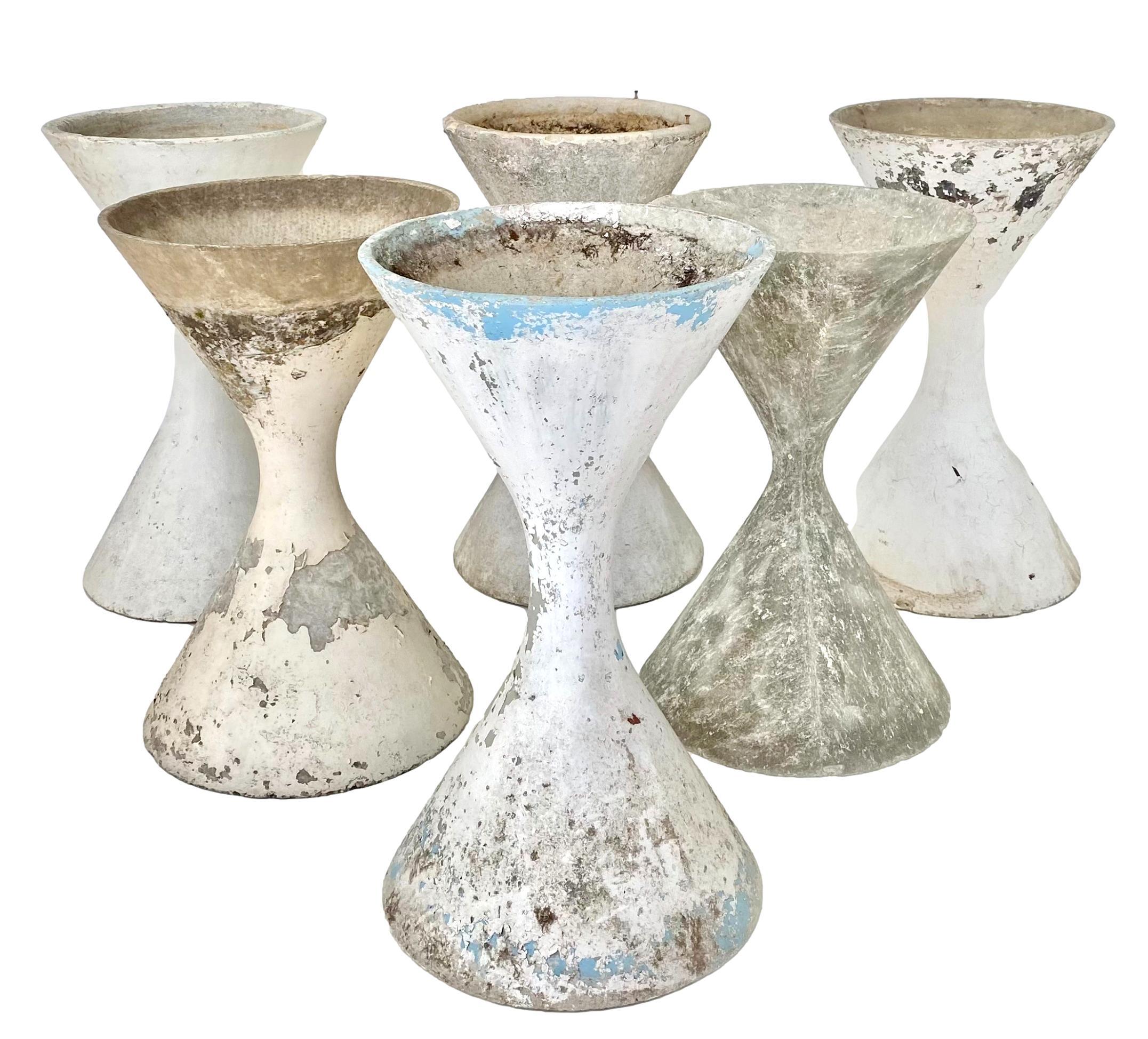 Concrete diabolo planter by Swiss Designer Willy Guhl. Varying degrees of patina to each planter. Available in multiple sizes and quantities. 

*8 available in this size. Priced individually.

Extra large 37