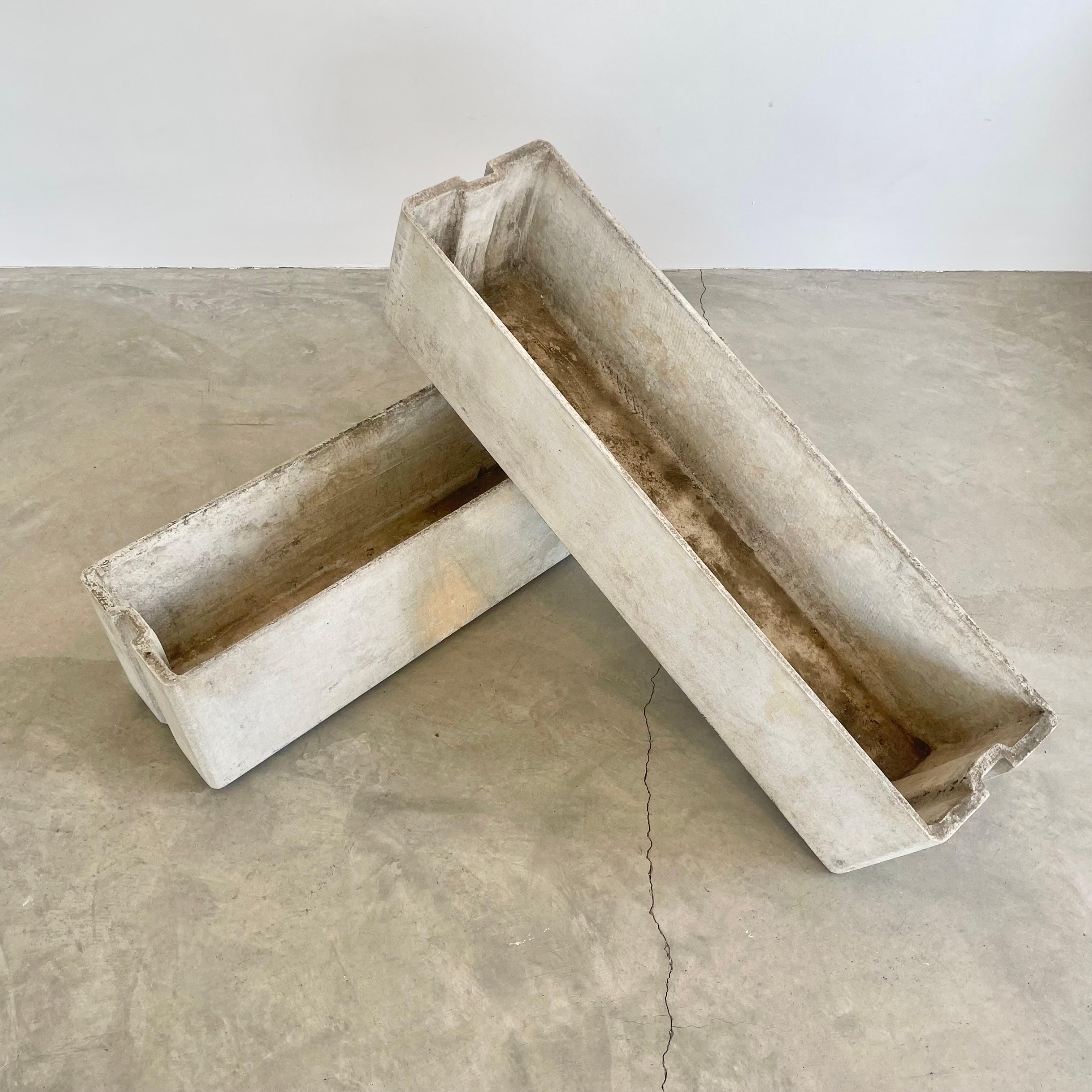 Rare and unique large trough planters by Swiss architect and industrial design pioneer Willy Guhl for Eternit, Switzerland circa 1960s. Both in original concrete with no paint and minimal patina. A subtle ridge is cast into each end of the planter