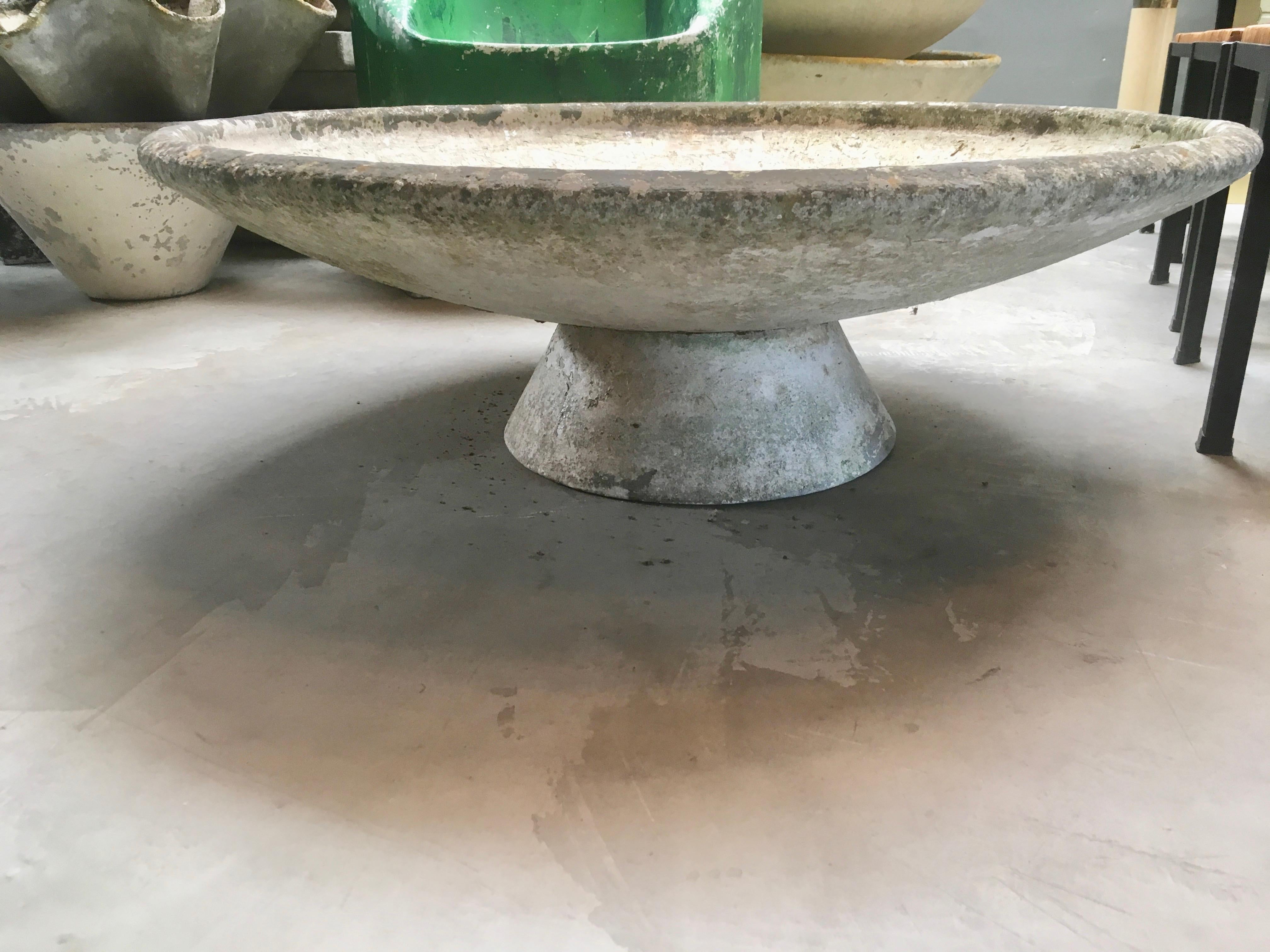 Fantastic cement planter by Swiss designer Willy Guhl for Eternit. Concrete pedestal base with massive concrete bowl that sits on top. Bowl can sit flat or angled in a multitude of directions. Great original patina. Great for indoors or outside.