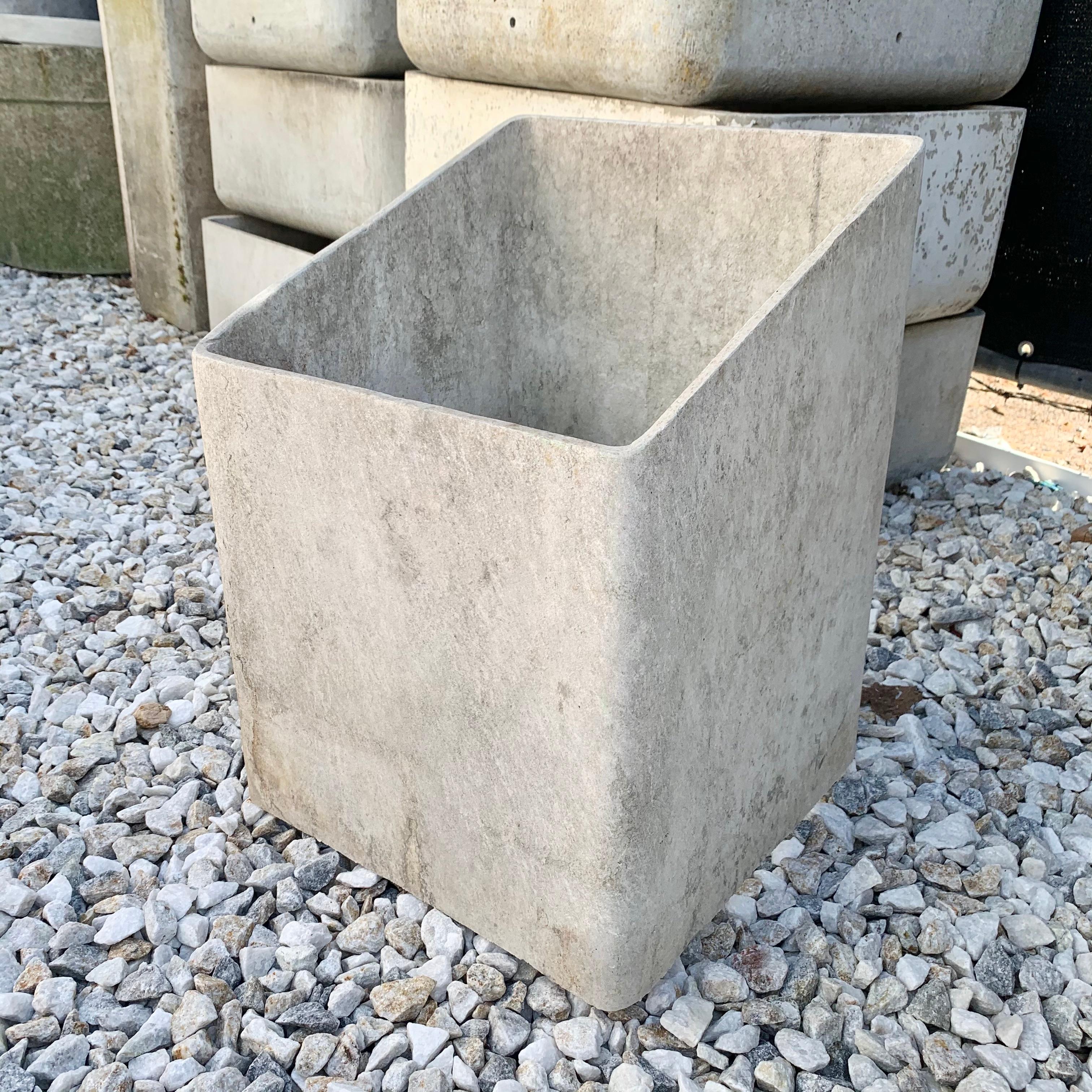 Unique, hollow concrete planter by Swiss architect Willy Guhl. Rectangular planter with hollow bottom. Perfect for large plants or small trees. Could also be used indoors/outdoors to place something inside that you don't want to look at, i.e. water