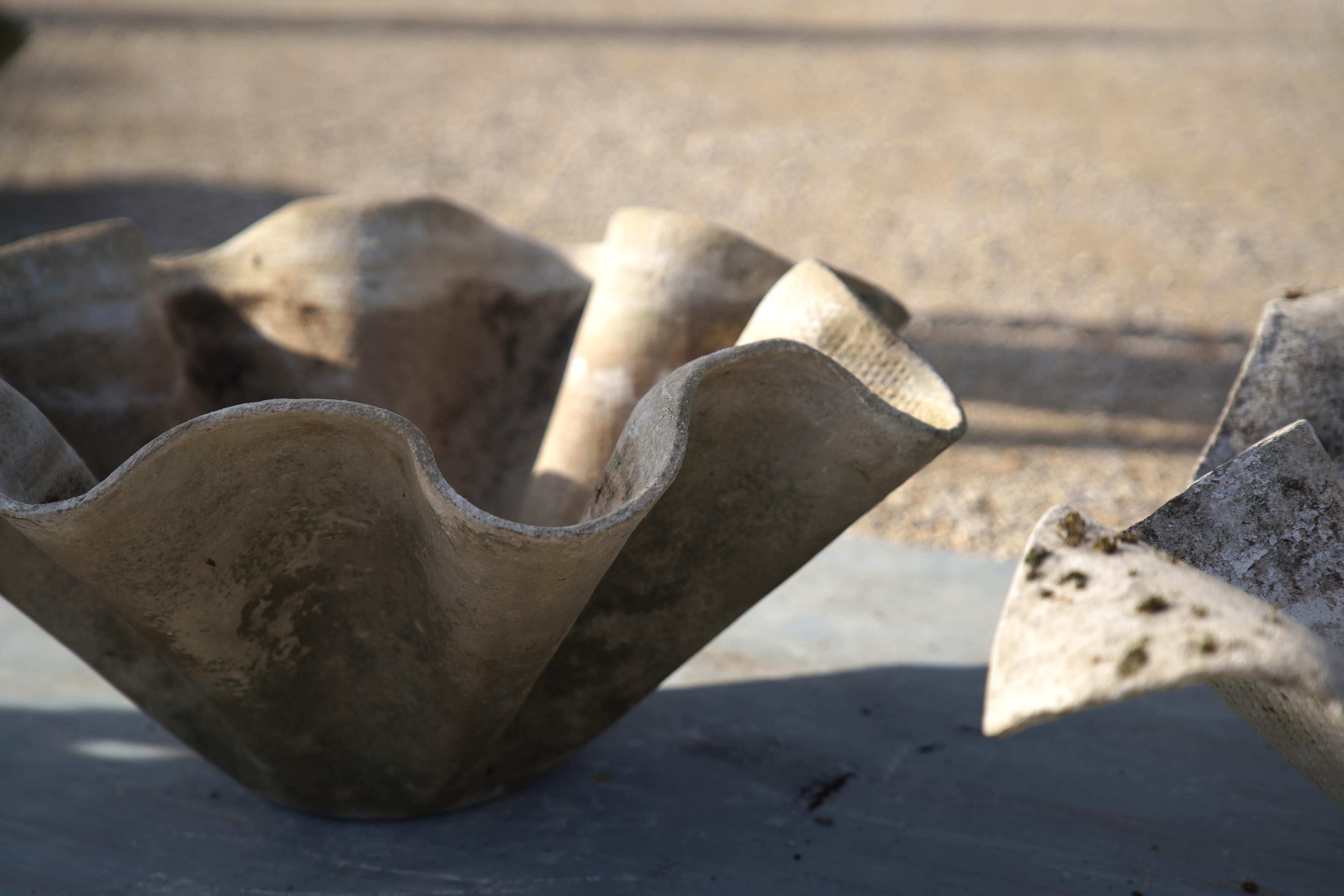 Exceptional sculptural garden planters designed by Willy Guhl for Eternit in Switzerland circa 1960s, often referred to as his 'Clam Shell' planters.

Resembling the architect's iconic elephant ear planters, this planter is made from fibrous cement