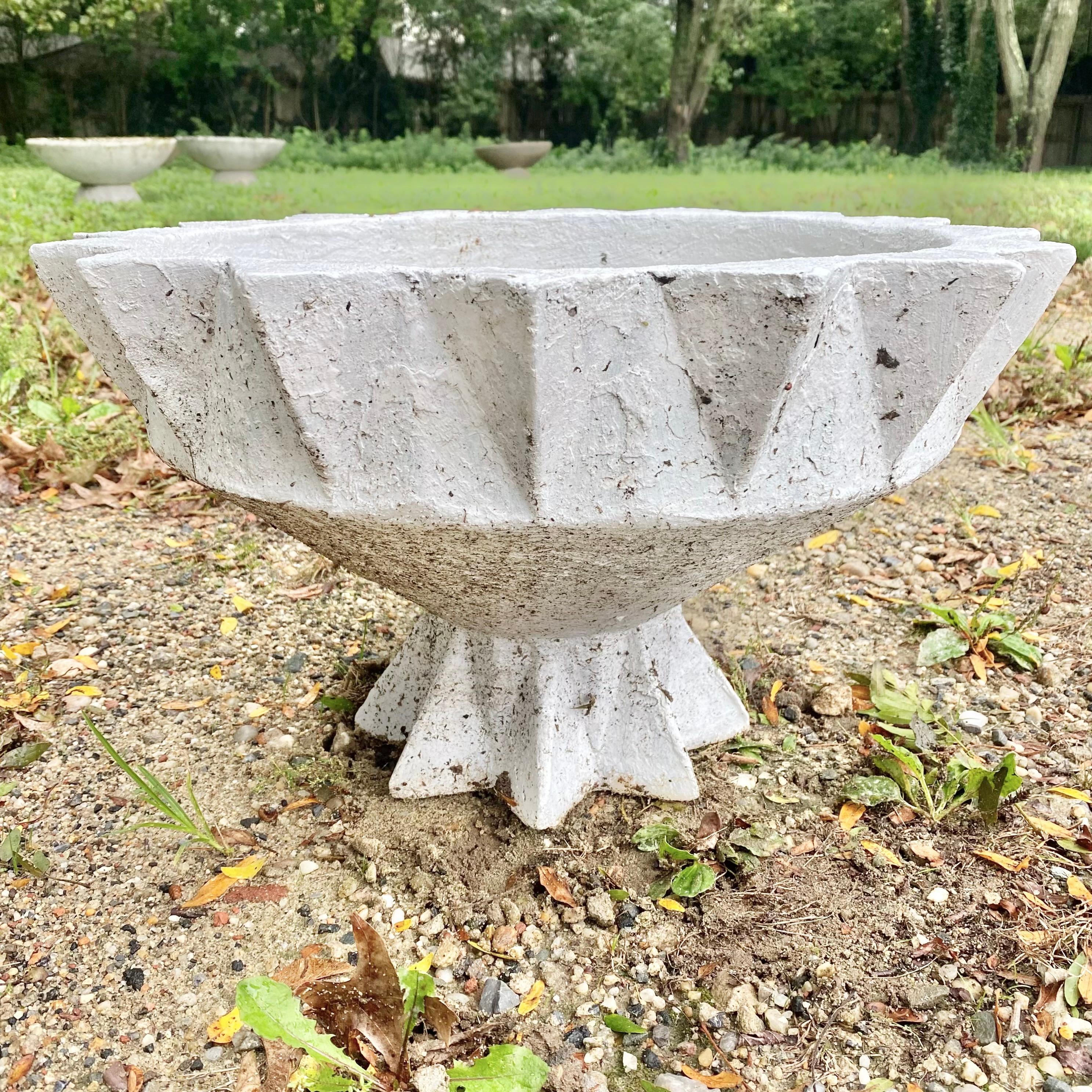 Unique concrete planters by Swiss architect Willy Guhl. Planter in the shape of a chalice. Especially unique in that the base matches the top with pointed facets. Great vintage condition. Two available in different patinas: one dark, one light.