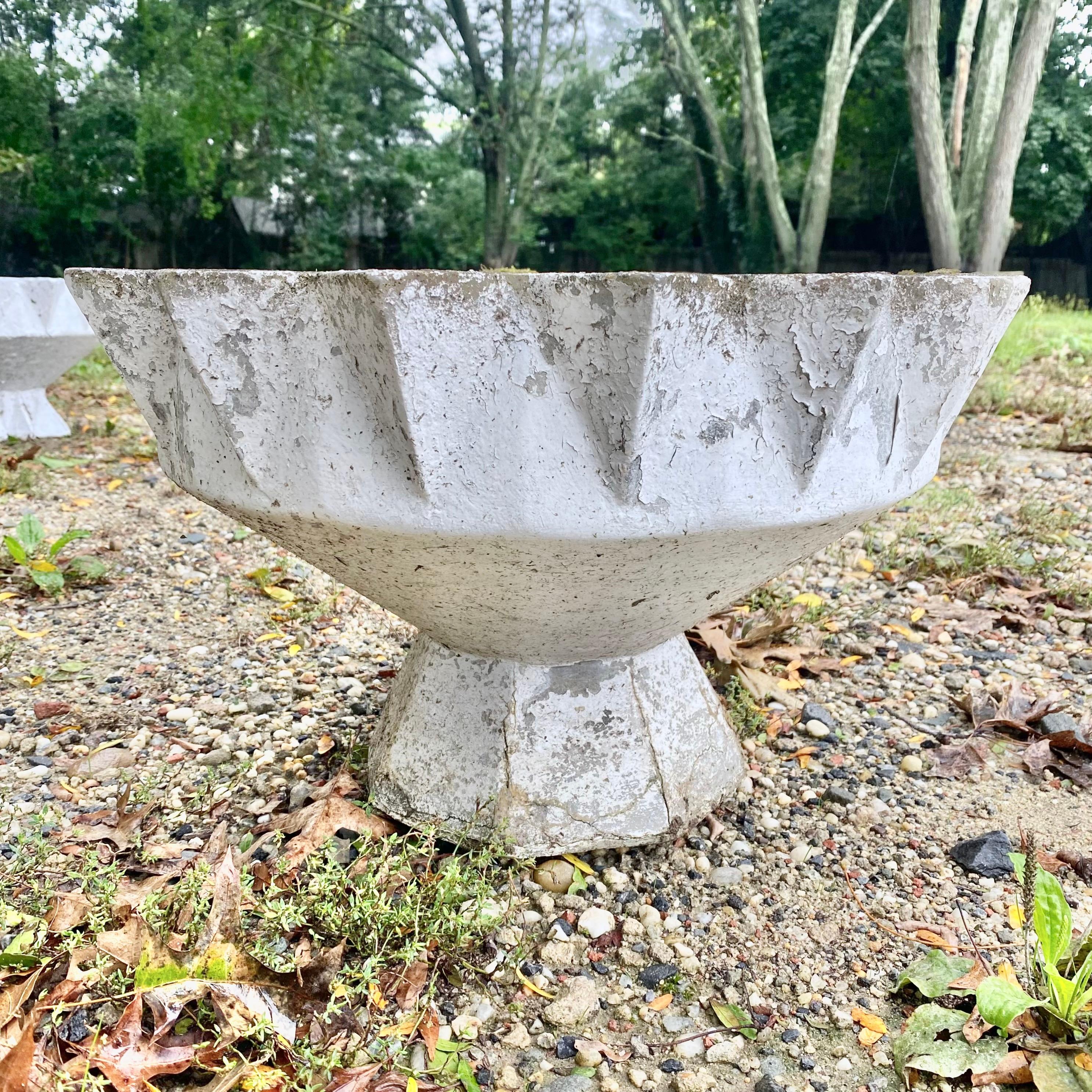 Unique concrete planter by Swiss architect Willy Guhl. Planter in the shape of a chalice. Base is also faceted. Beautiful patinas. Great vintage condition. 2 available as shown in this listing. Priced individually. Description below matching image