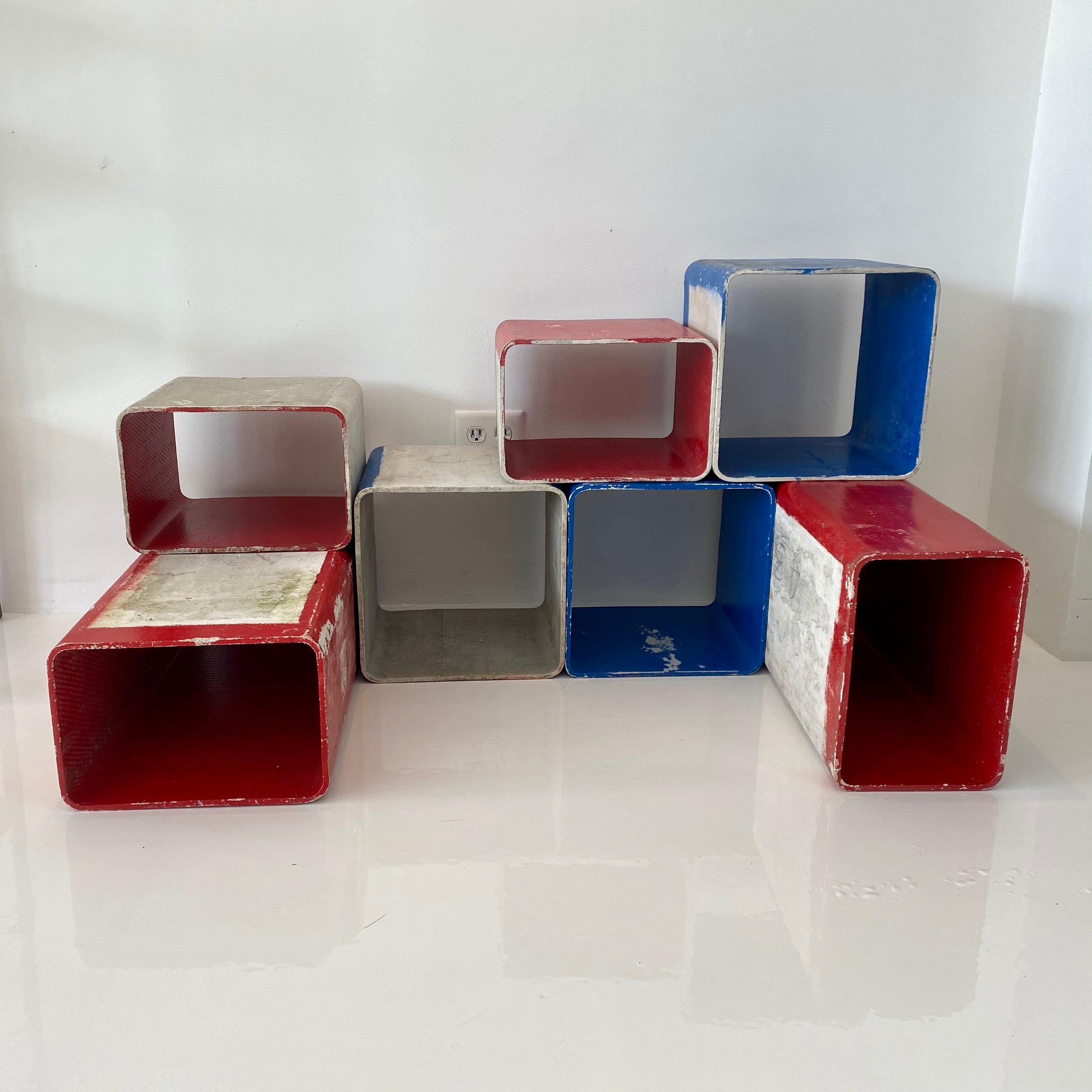 Unique set of painted red and blue concrete cubes by Swiss architect and designer Willy Guhl. handmade in the early 1960s in Switzerland. Produced by Eternit. Set of 7 cubes in great original condition. Can be arranged in a multitude of ways.