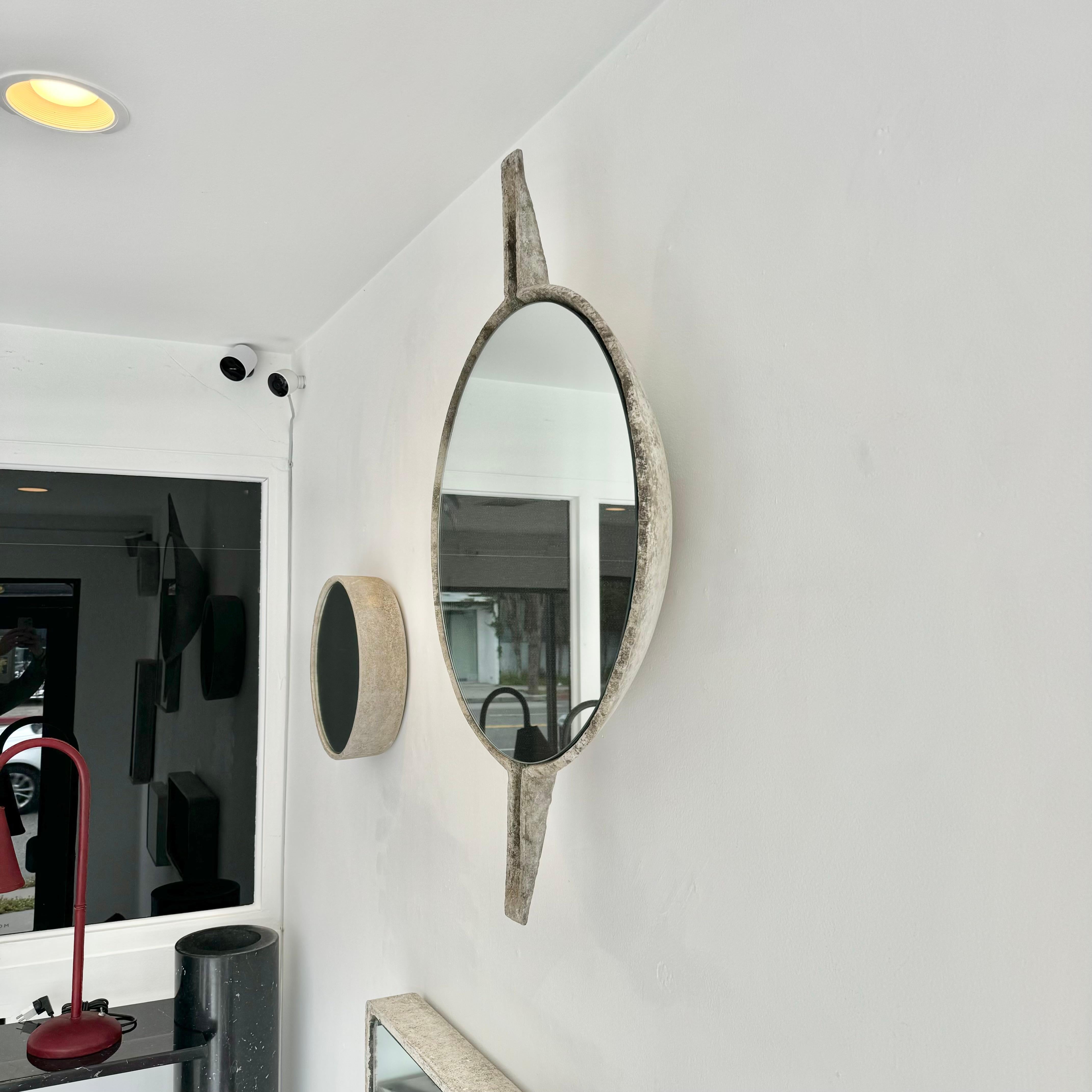 Beautiful Willy Guhl concrete mirror. Round bowl with vertical spikes. Substantial concrete vessel originally produced at the Eternit factory in Switzerland in the 1960’s. Custom mirror/glass was professionally hand cut and added recently. Beautiful