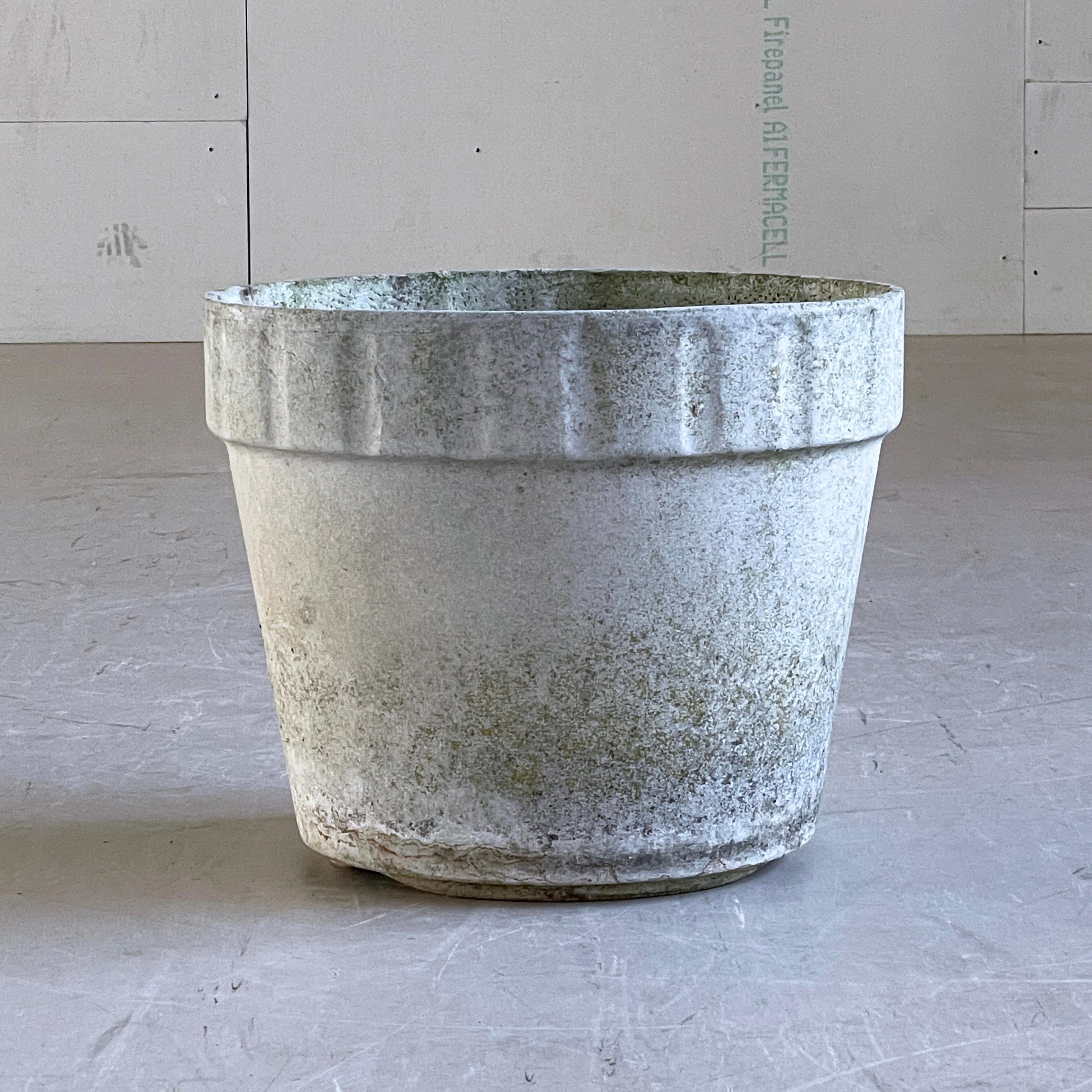 Monumental concrete flower pot by Swiss designer, Willy Guhl. Solid concrete made in Switzerland 1960 - 1970. Produced by Eternit AG.  
Tapered structure with a ribbed upper section with drainage holes. In original condition with beautiful