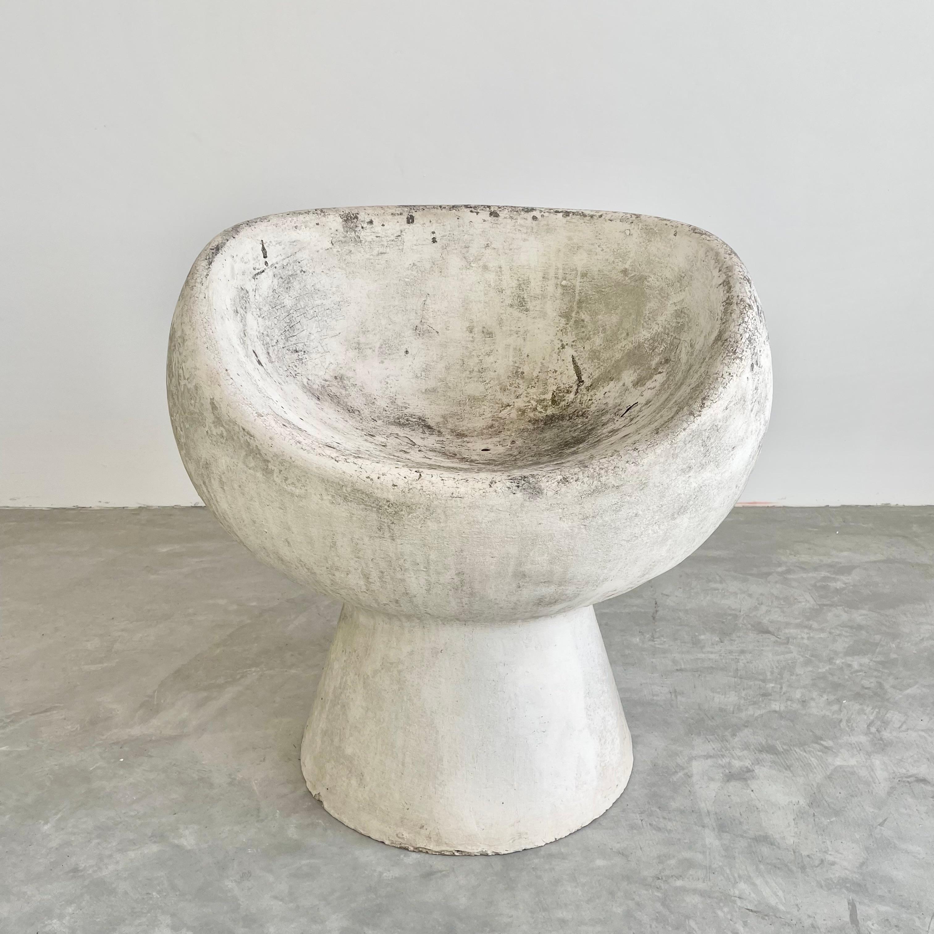 Stunning concrete pod chair designed by Swiss Architect Willy Guhl. Hand made in Switzerland by Eternit in the 1960s. Excellent patina. Factory drilled hole for water to drain. Great sculptural pieces. Perfect for indoors or outside. Priced
