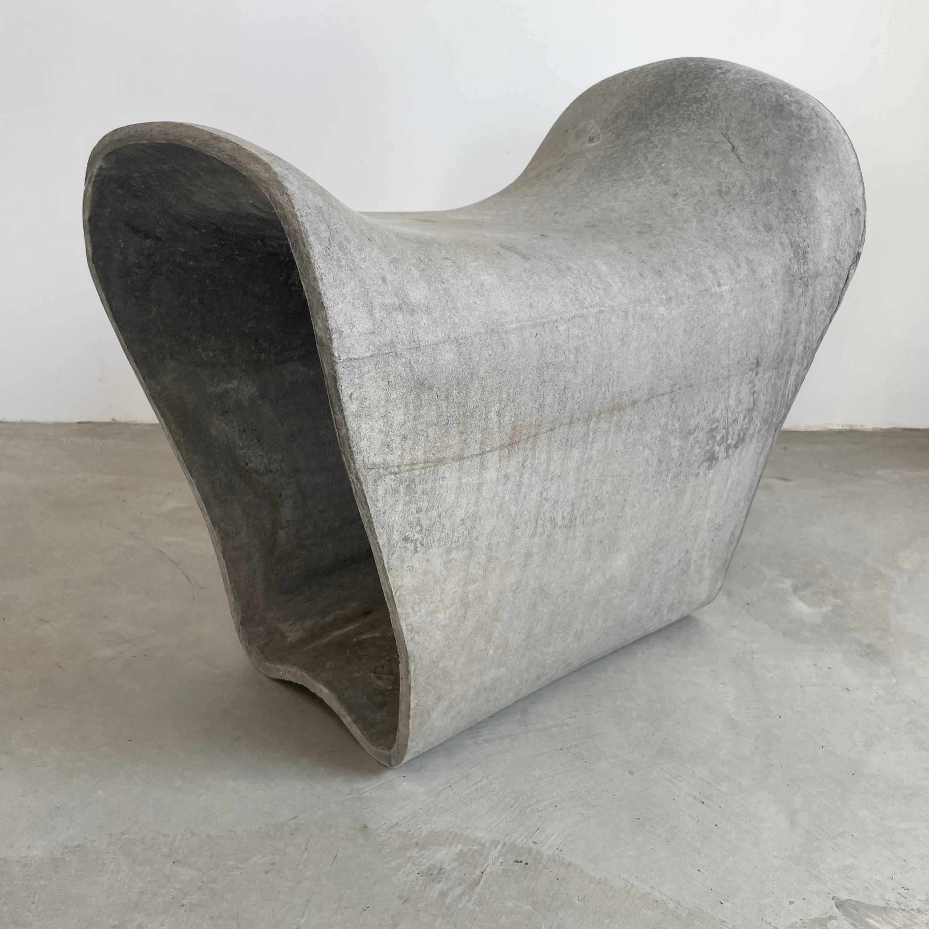 Rare concrete stool by Willy Guhl in the shape of a saddle. Hand-made in Switzerland in the 1960s, Excellent condition and design. Great sculptural pieces with beautiful soft lines. Surprisingly comfortable. Perfect for indoors or outside. Priced