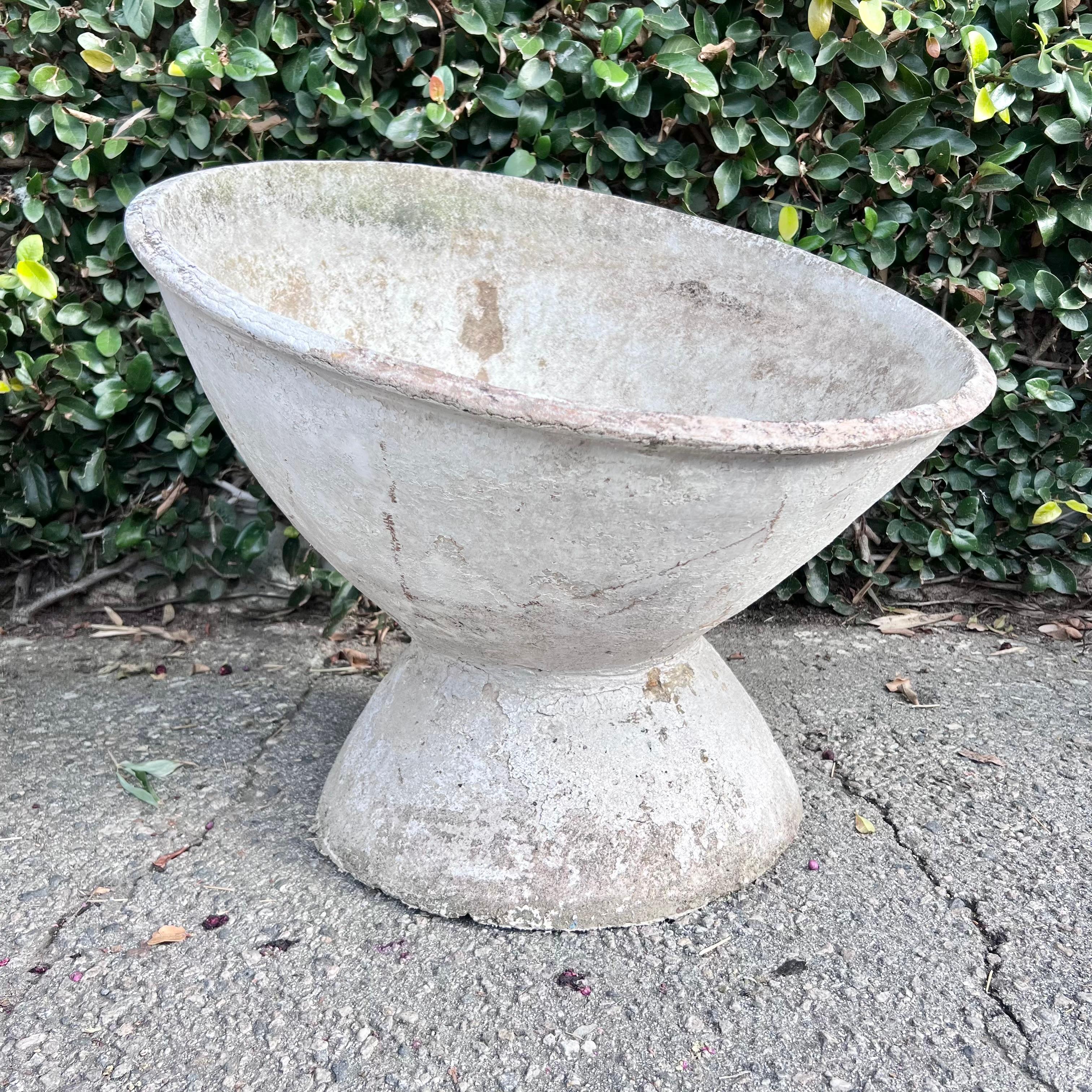 Stunning concrete tilted bowl planter by Swiss architect Willy Guhl. Dome shaped concrete base with built in offset concrete bowl. Beautiful planter with dominant presence. 21