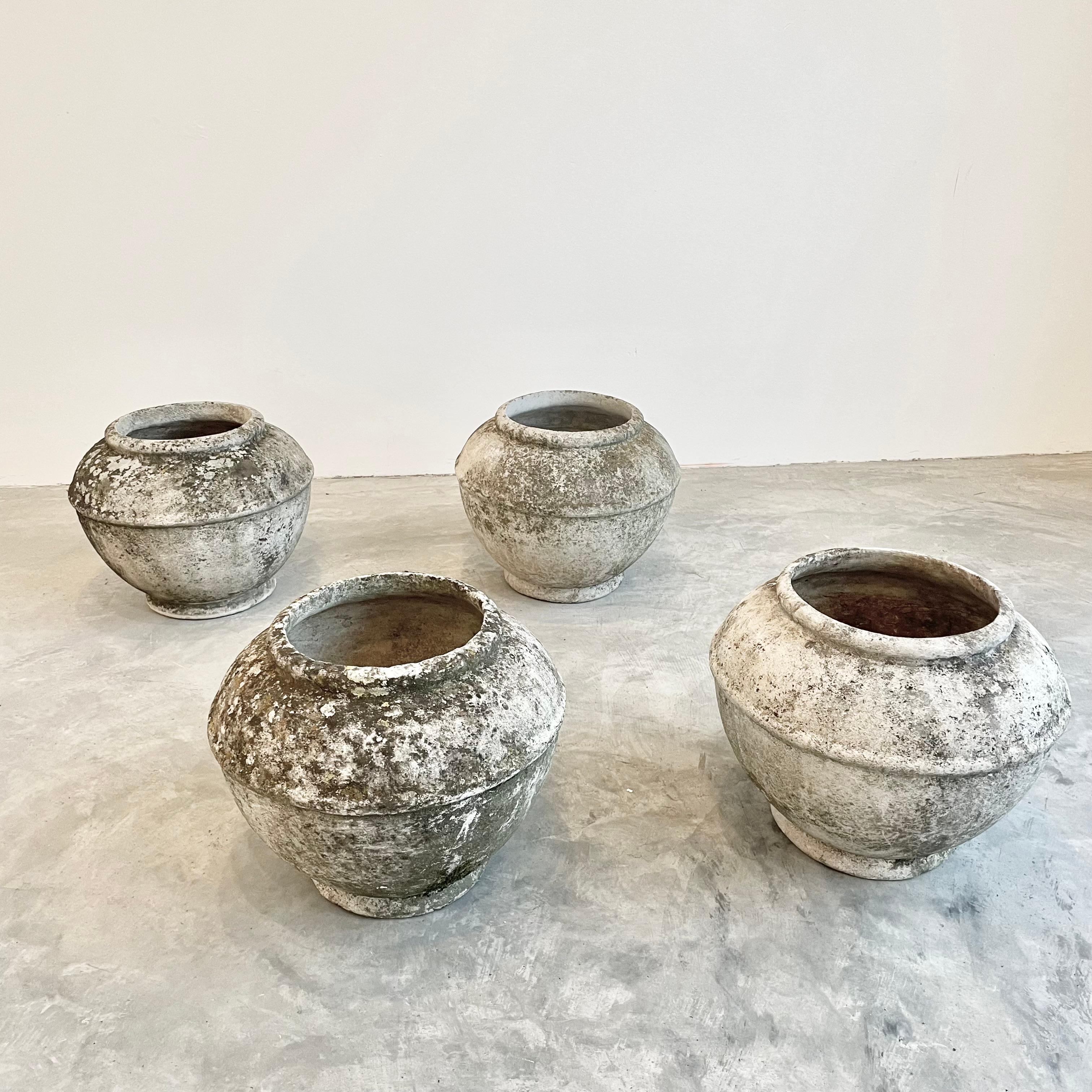 Fantastic concrete vases by Swiss architect Willy Guhl for Eternit. Great tabletop vase or planter in a stunning natural patina. Very unusual shape. Great indoors or outside. Each planter is dated 1969 or 1975 on the base. Simple design and very