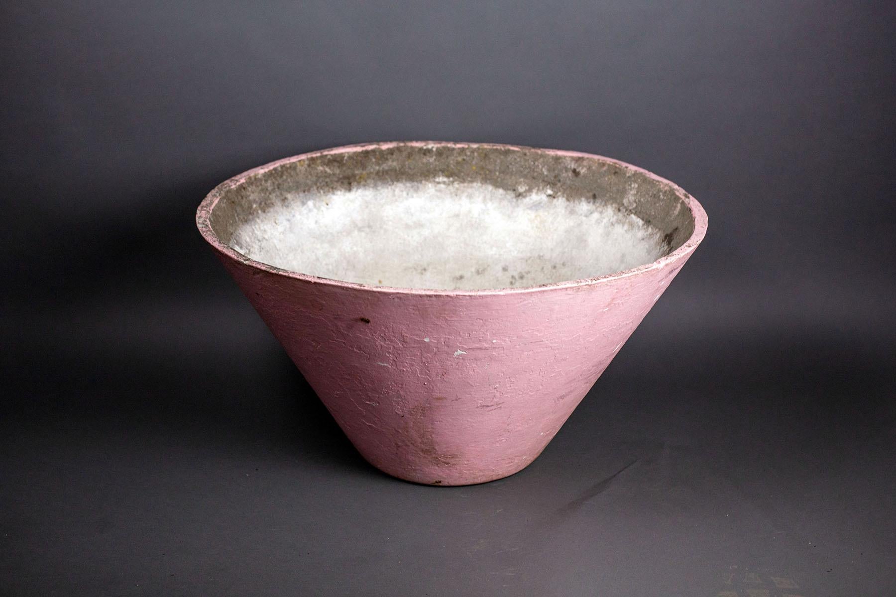 We presents for your consideration, this fantastic willy Guhl cone shaped planter exhibiting a lovely and vintage layer of pink paint. 


As of the mid-20th century, the work of Willy Guhl was a revolutionary feat of industry and design with a