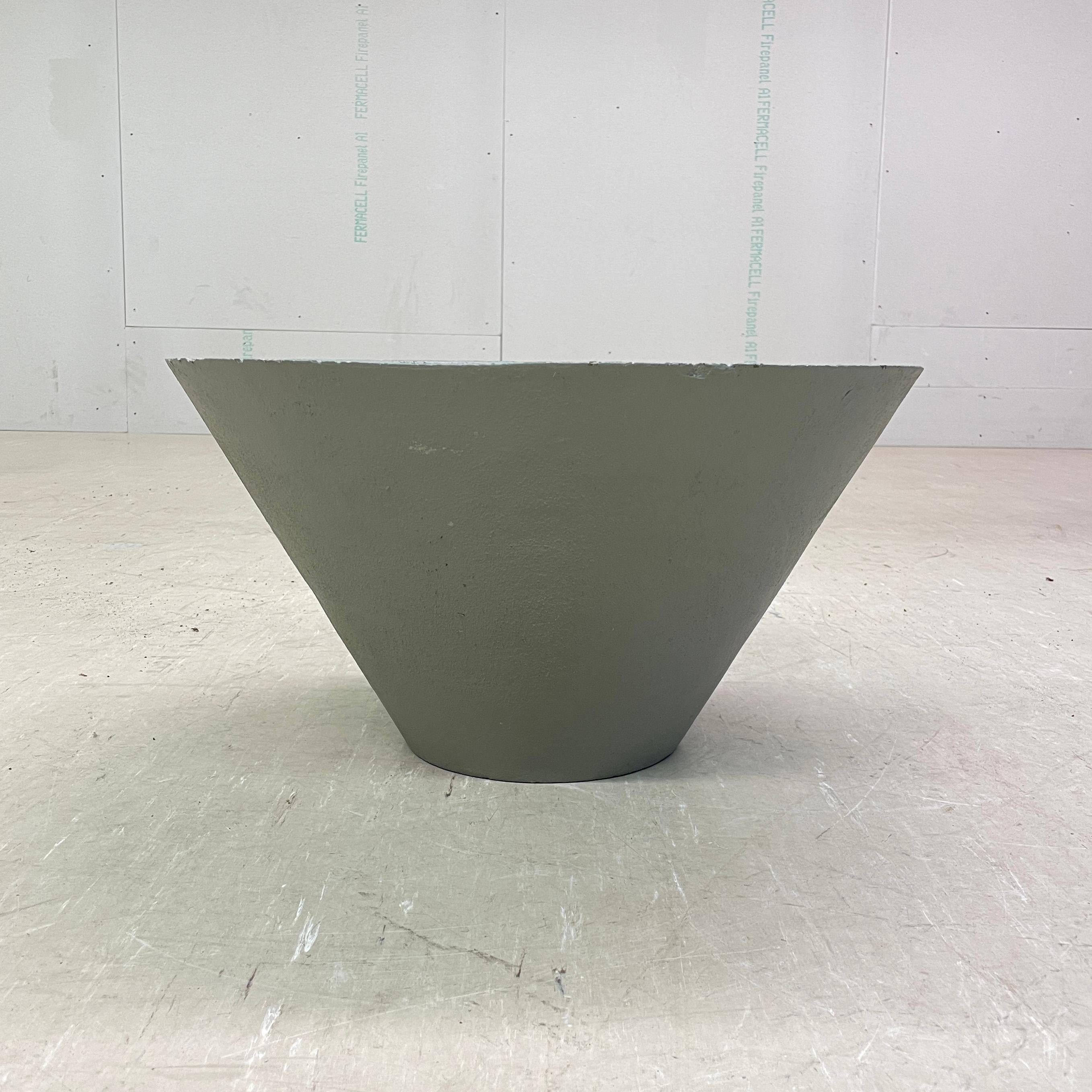 Conical concrete flower pot by Swiss designer, Willy Guhl. Solid concrete made in Switzerland 1960 - 1970. Produced by Eternit AG.  
Tapered structure with drainage holes in base. The outer side and top edge of the inner side of the Planter has been