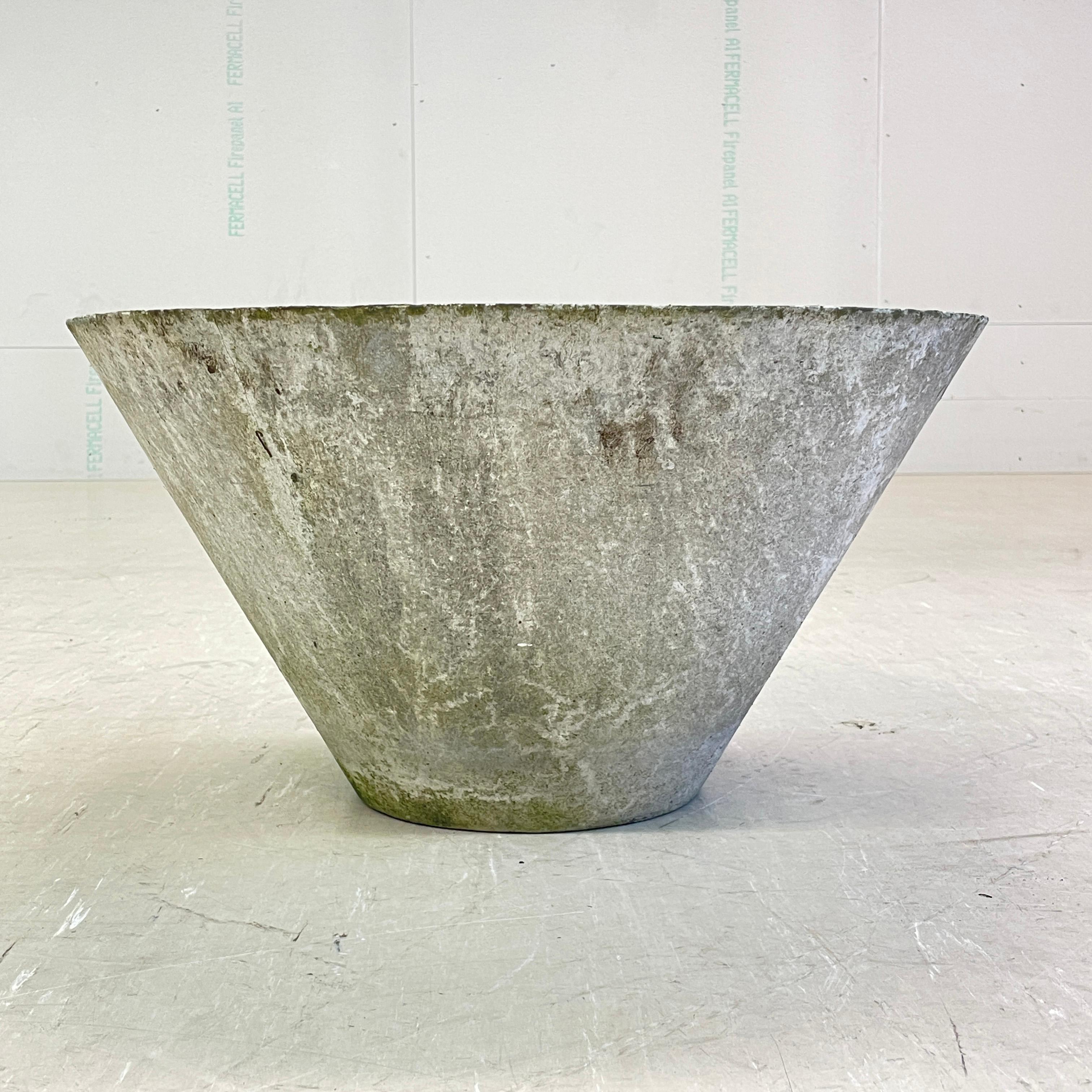 Conical concrete flower pot by Swiss designer, Willy Guhl. Solid concrete made in Switzerland 1960 - 1970. Produced by Eternit AG.  
Tapered structure with drainage holes in base. In original condition with beautiful patination achieved over decades