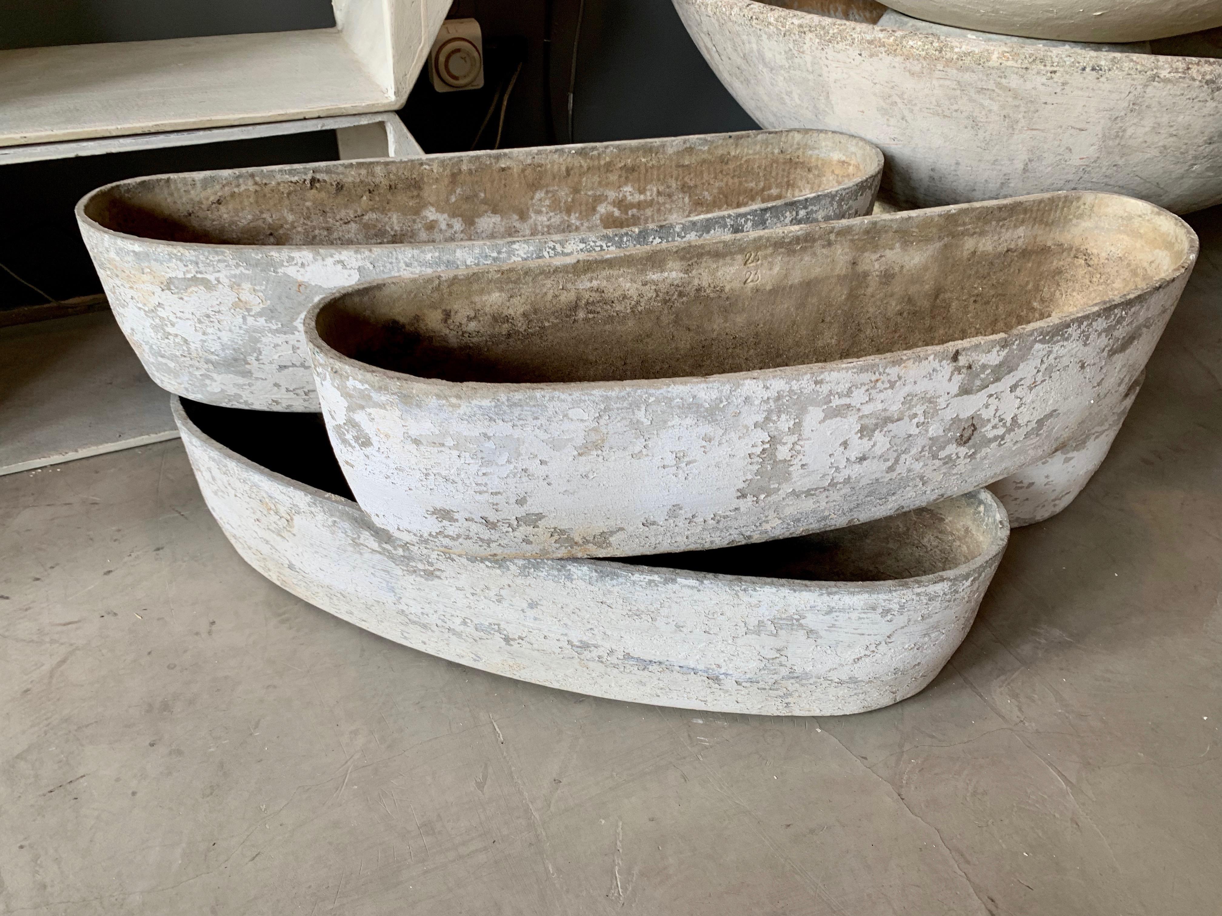 Fantastic crescent shaped planters by Willy Guhl. Great for window sills and narrow walkways. Flat back with curved front. Four available. Priced individually. 
 