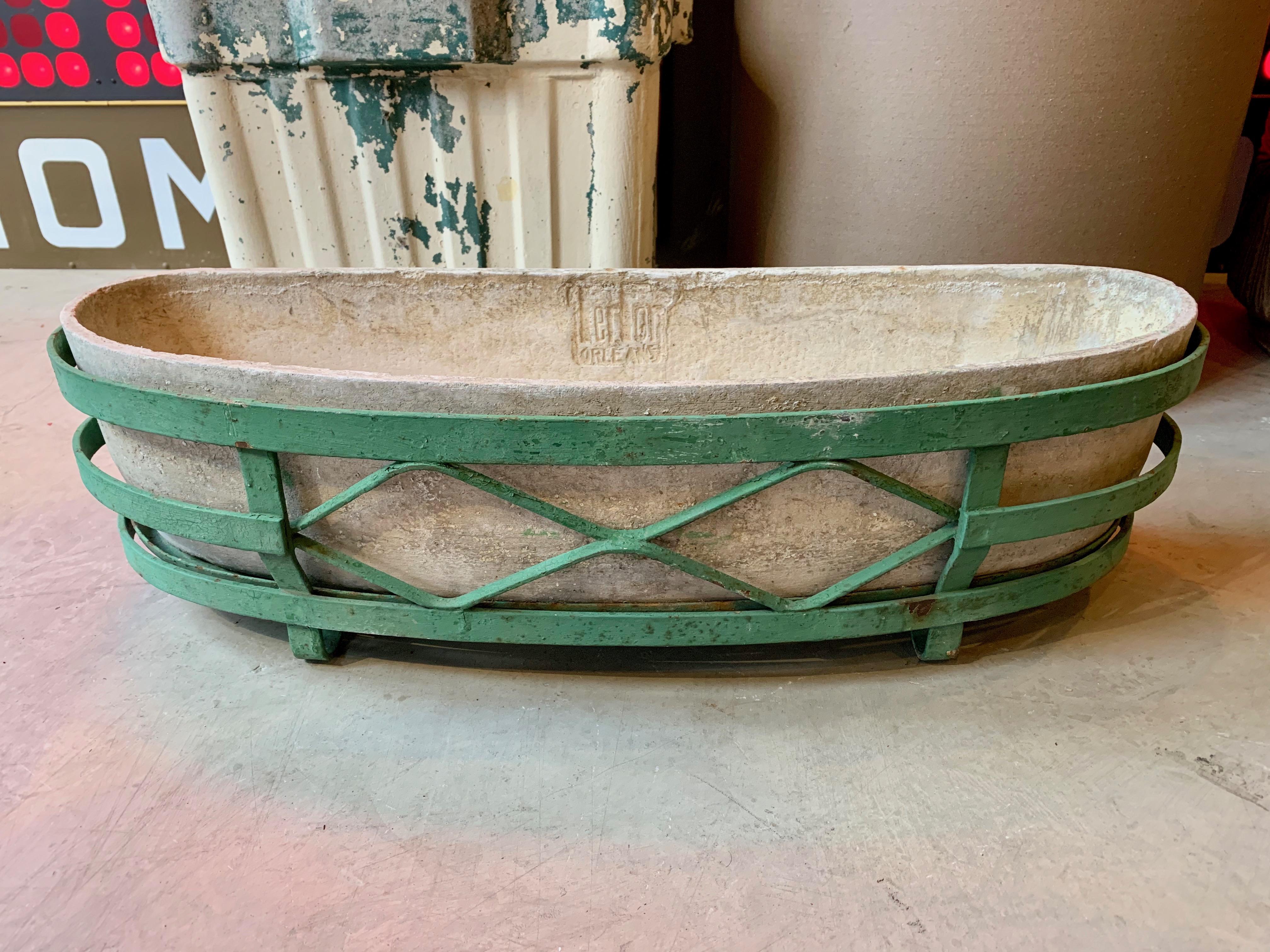 Fantastic crescent shaped planters by Willy Guhl. Great for window sills and narrow walkways. Original metal stand included. Flat back with curved front. Three available. Priced individually.

   