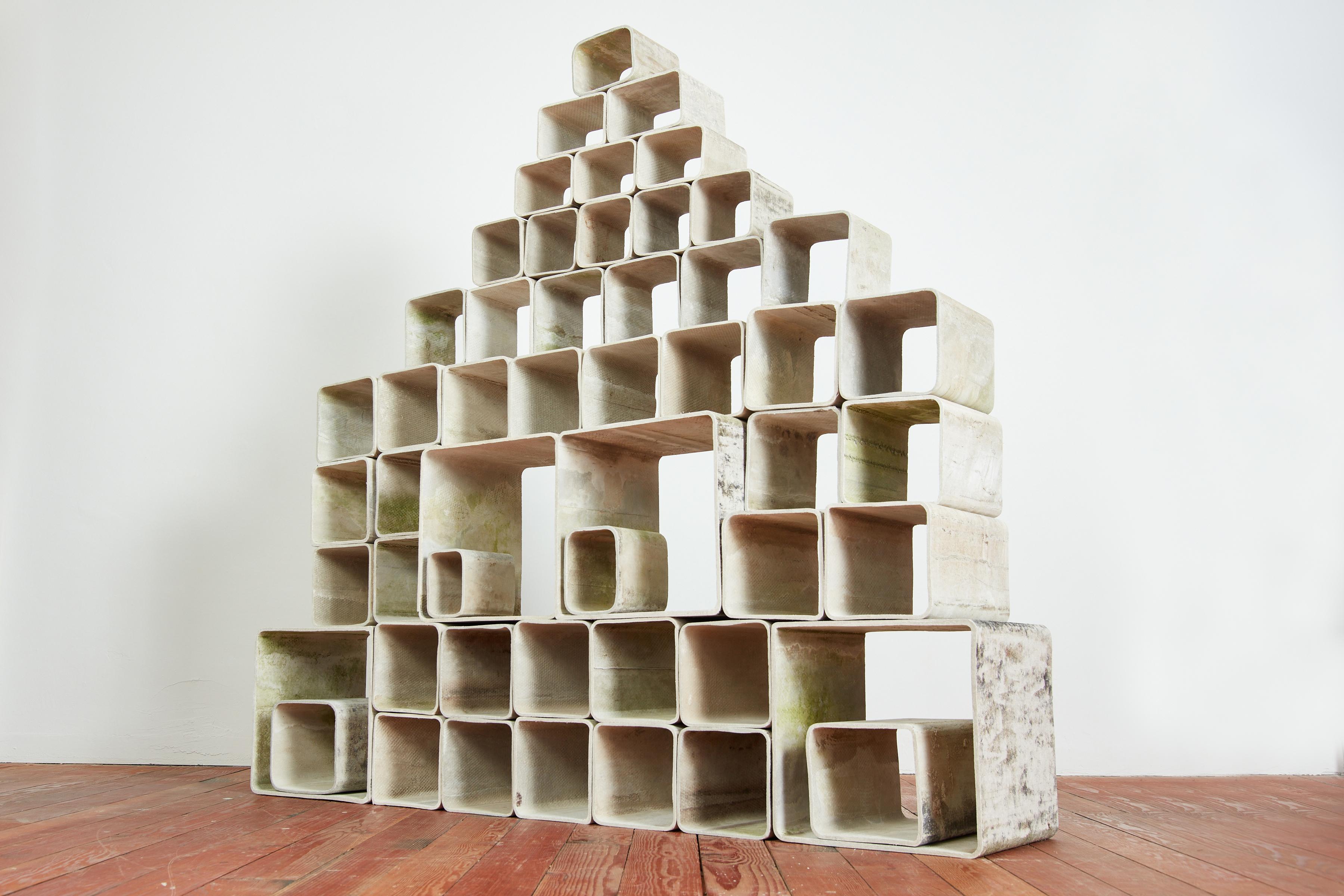 Incredible 52 piece concrete modular bookcase by Willy Guhl
Composed of different sized concrete cubes - can be arranged in various different forms according to space and use. 
Great as a room divider or bookcase. 
Wonderful patina 
Extremely