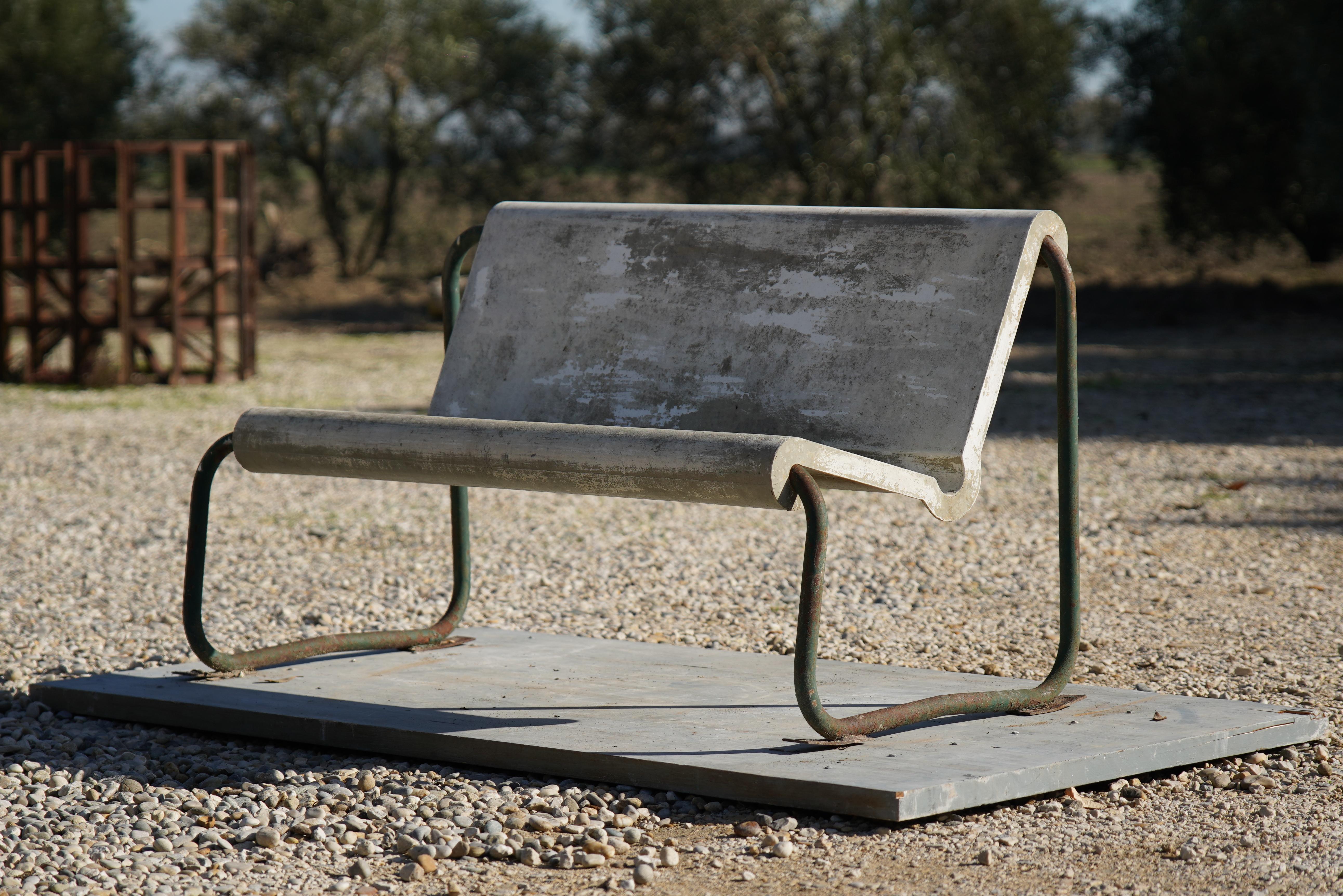 Stunning floating bench designed by Swiss Architect Willy Guhl for Eternit, Switzerland, circa 1960. Made of reinforced fiberglass and steel tubular frame. Incredible patina to both seat and frame which are both in original, untouched condition.