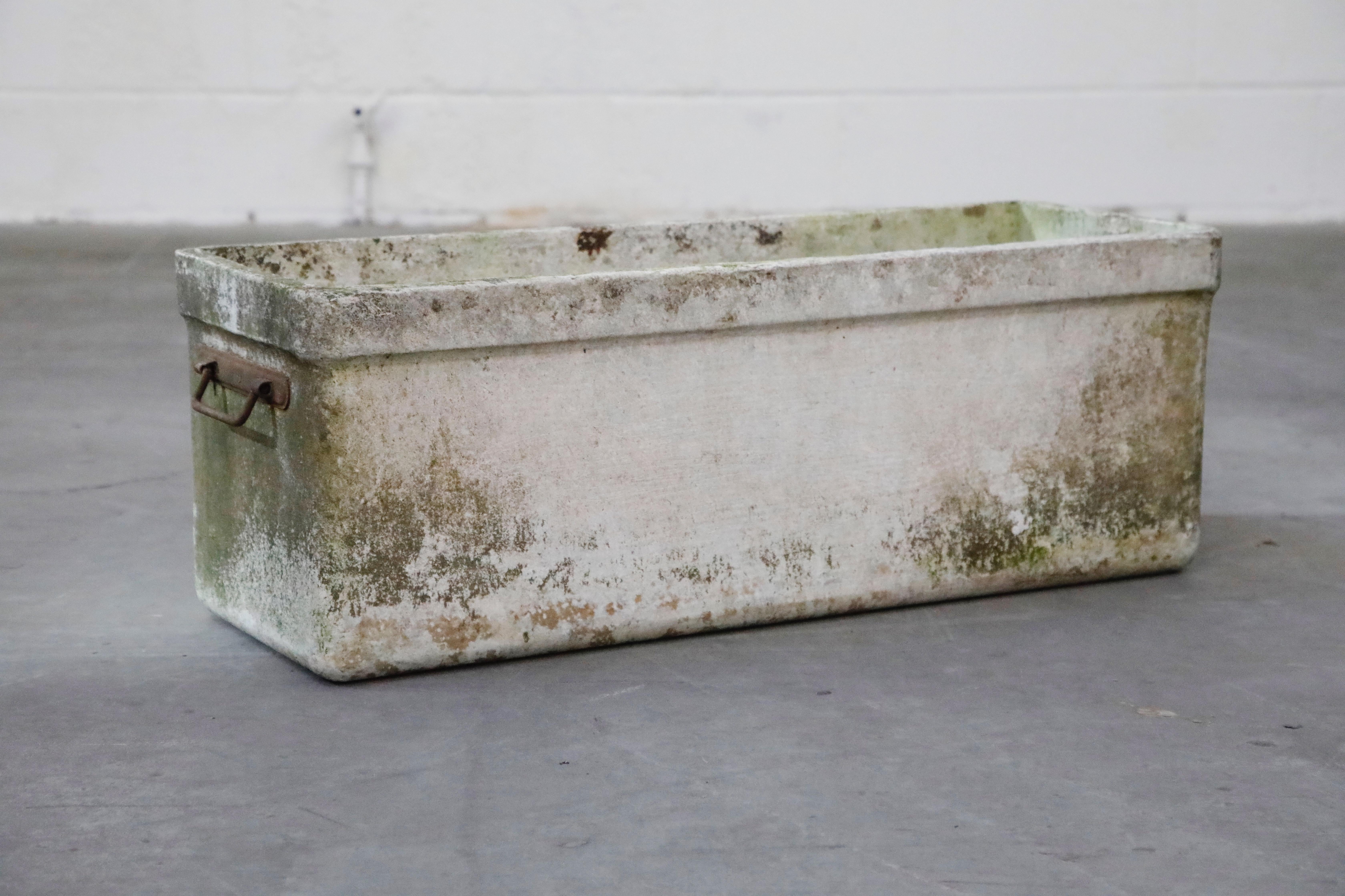 Incredibly gorgeous, this is a rare large rectangular planter with metal handles by Swiss architect Willy Guhl for Eternit, circa 1968, Switzerland.

The patina and age on this example is simply beautiful. For interior designers and collectors,