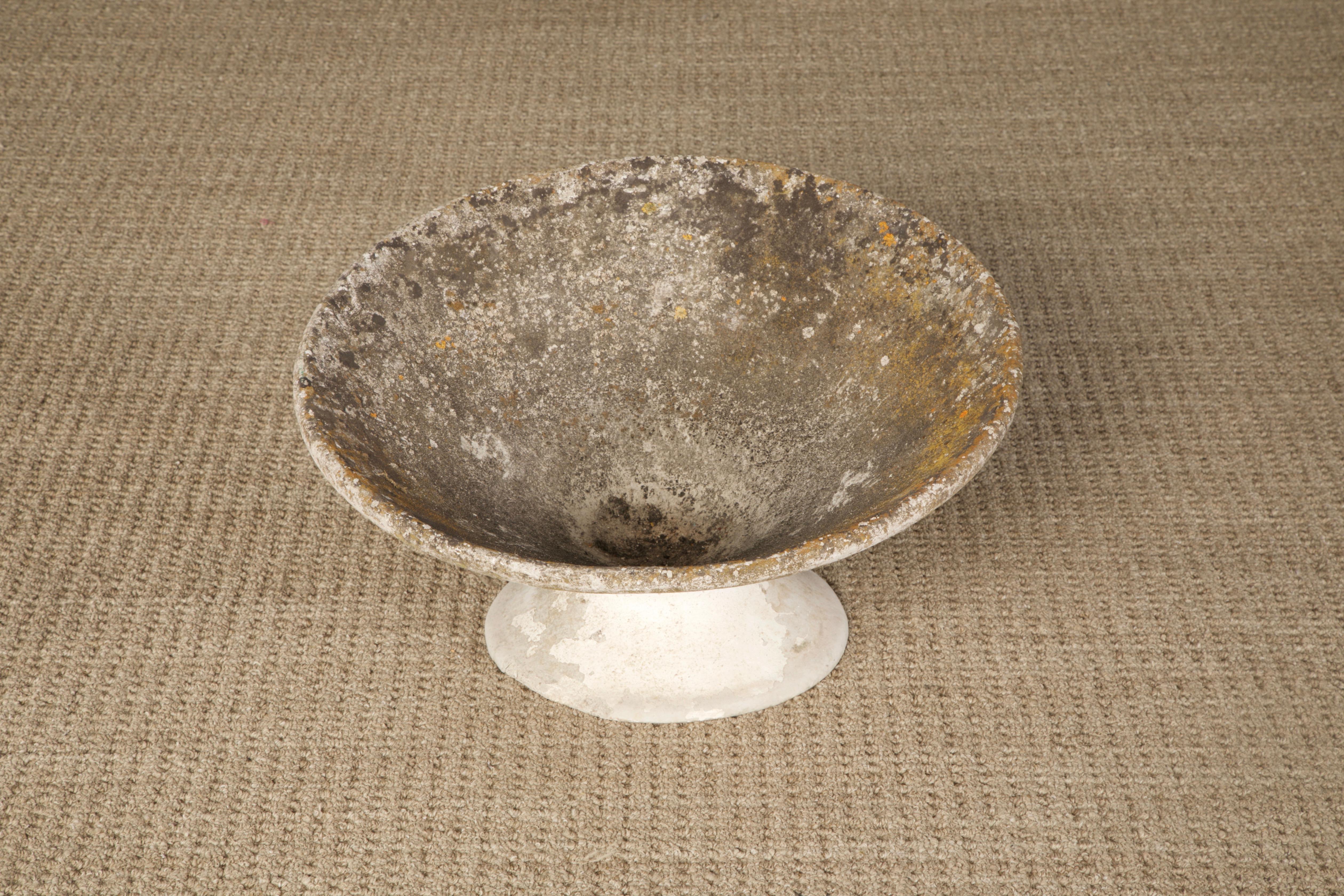 A beautiful tilted spindle concrete planter by Swiss architect Willy Guhl for Eternit, circa 1968, Switzerland. This special 'tilted' hourglass shaped concrete spindel planter has a patinated natural finish including fine moss and lichens. Excellent
