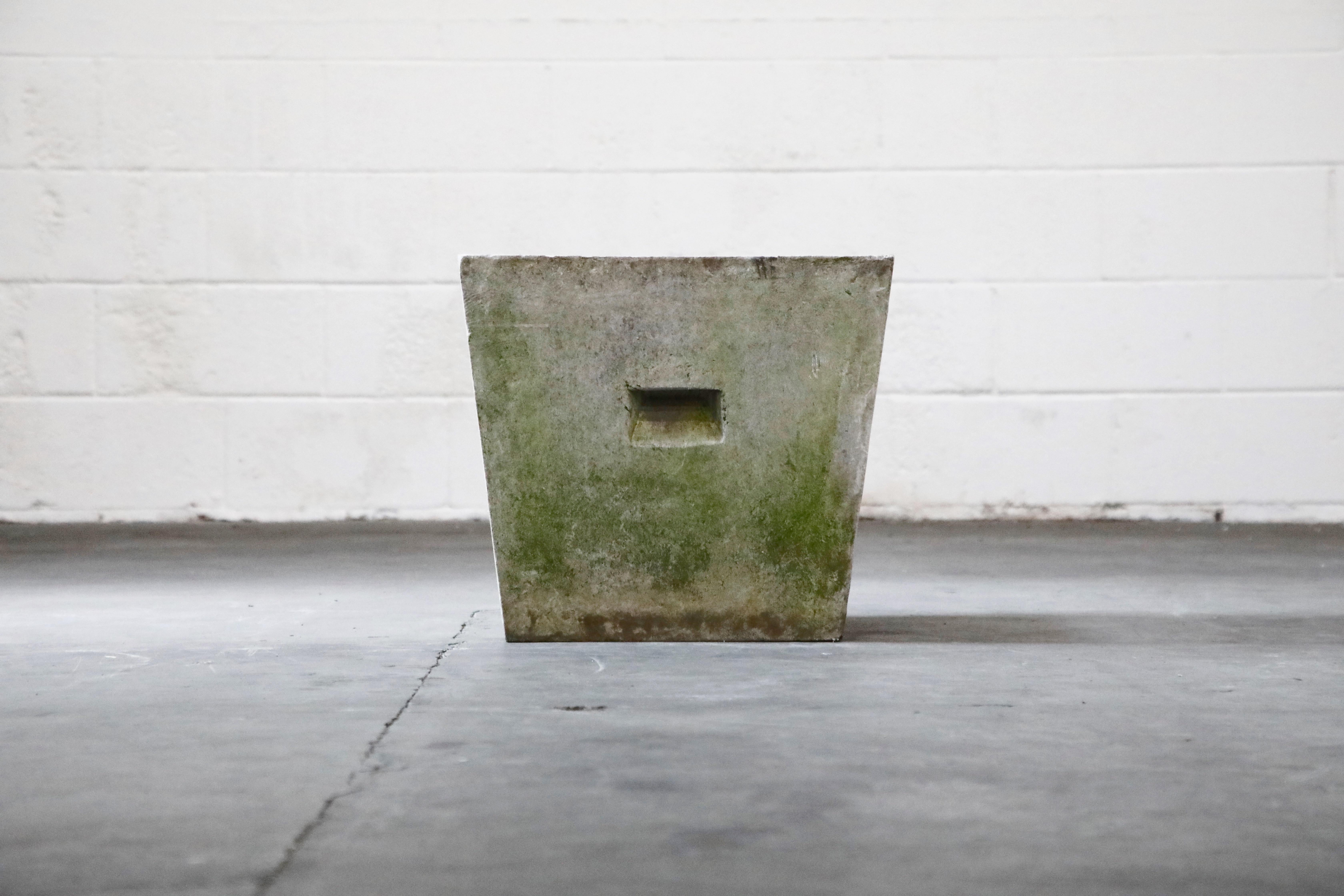 This designer on-trend architectural trapezoid concrete planter with handles was designed by Swiss architect Willy Guhl for Eternit, circa 1968 Switzerland. This special Trapezoid shaped concrete handle planter has a patinated natural exterior