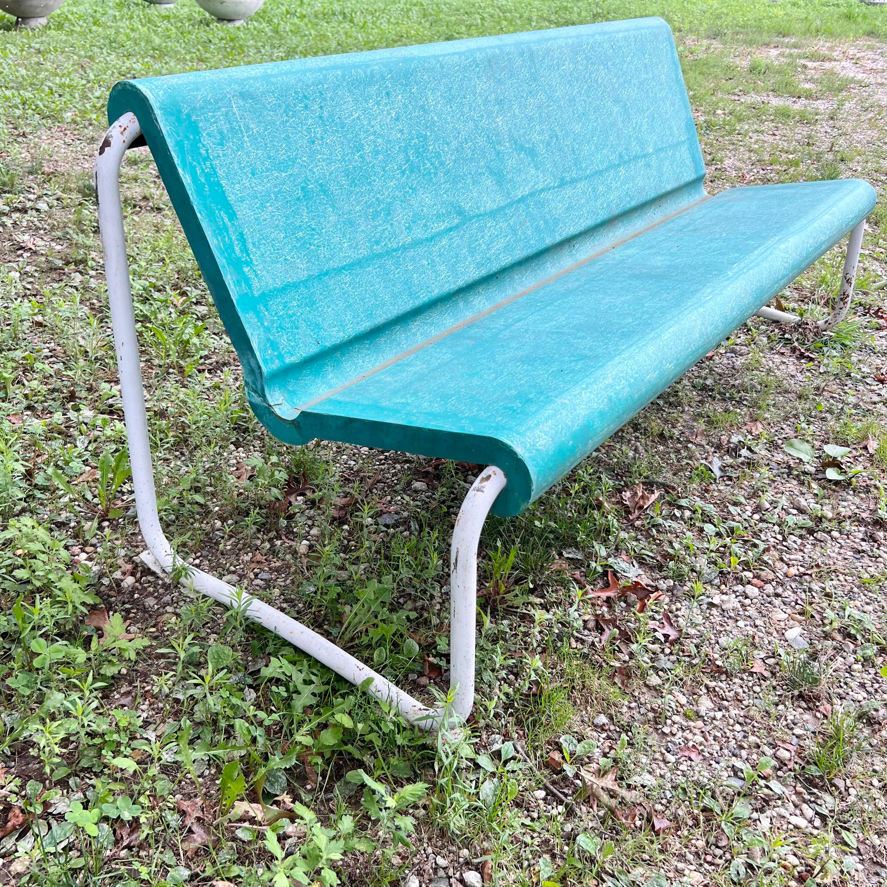 Remarkable mid-century floating bench by Swiss Architect Willy Guhl. Circa 1960s. Perfect minimal design as is common with the Swiss designer. Light weight but sturdy. The electric green seat is made of fiberglass and is suspended by a cream tubular