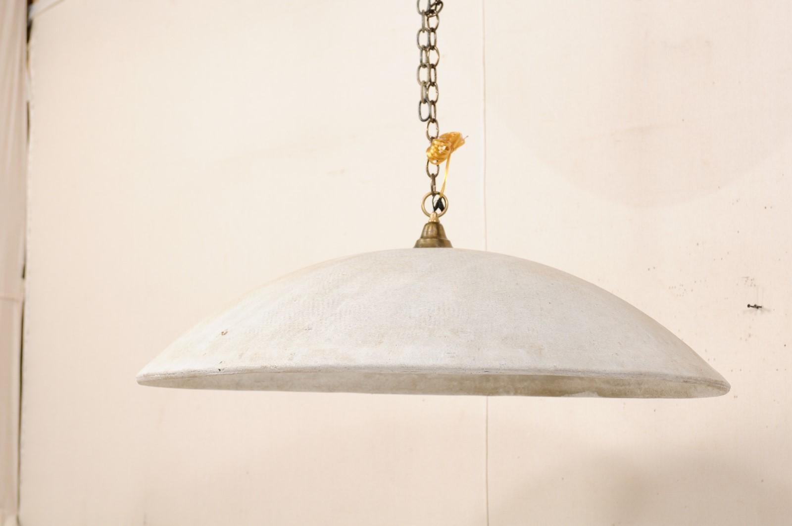 A nicely-sized, midcentury hanging dome light created by Swiss neo-functionalist designer Willy Guhl (1915-2004). This vintage chandelier, in typical Willy Guhl fashion, is constructed of eternite (a durable and light-weight fiber cement), and