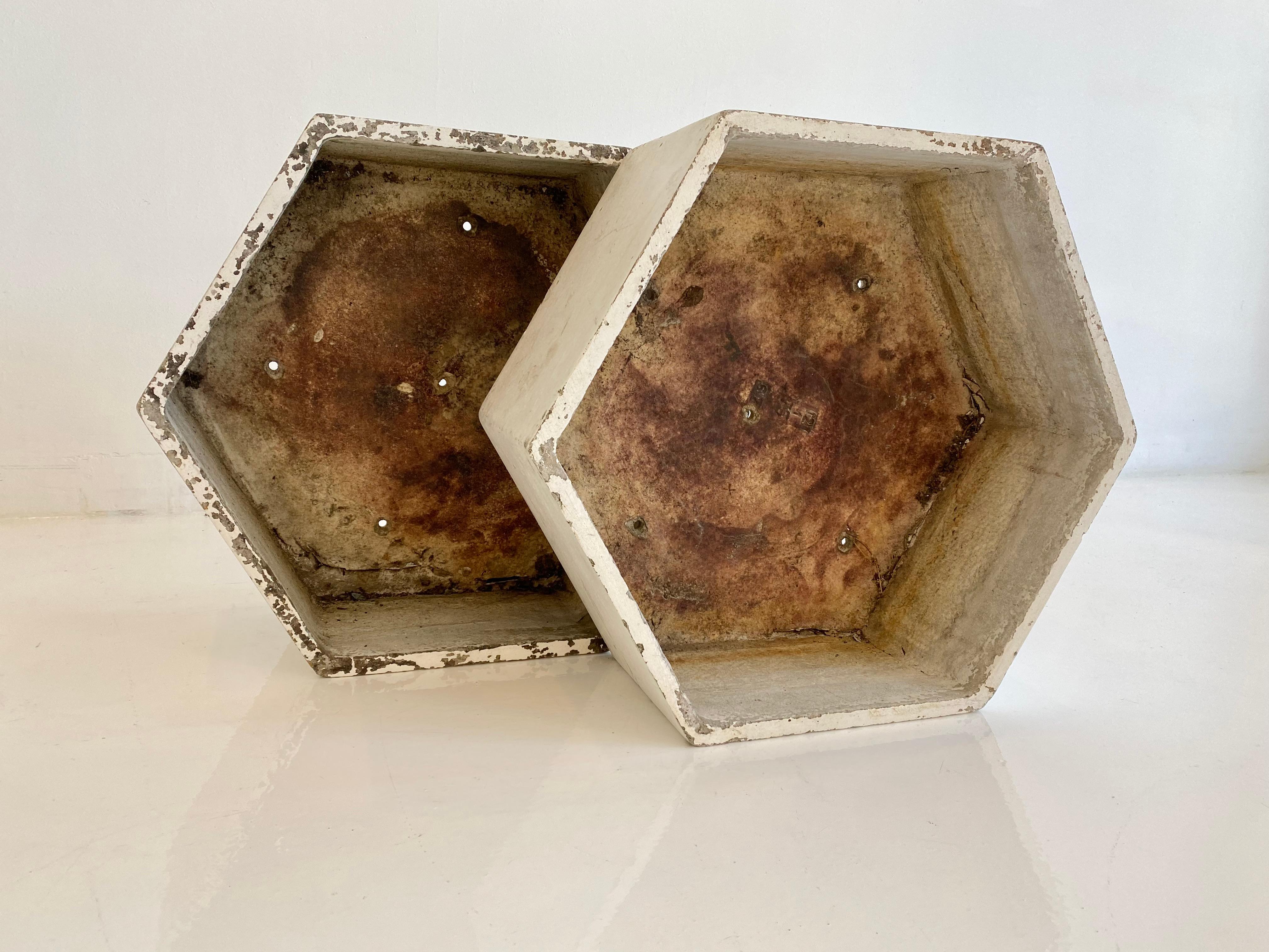Fantastic pieces of sculpture by Swiss architect Willy Guhl. Concrete geometric planters in the shape of a hexagon. Cool sculptural pieces for indoor or outdoor use. Great standalone pieces of art. Excellent vintage condition. 2 available.

     