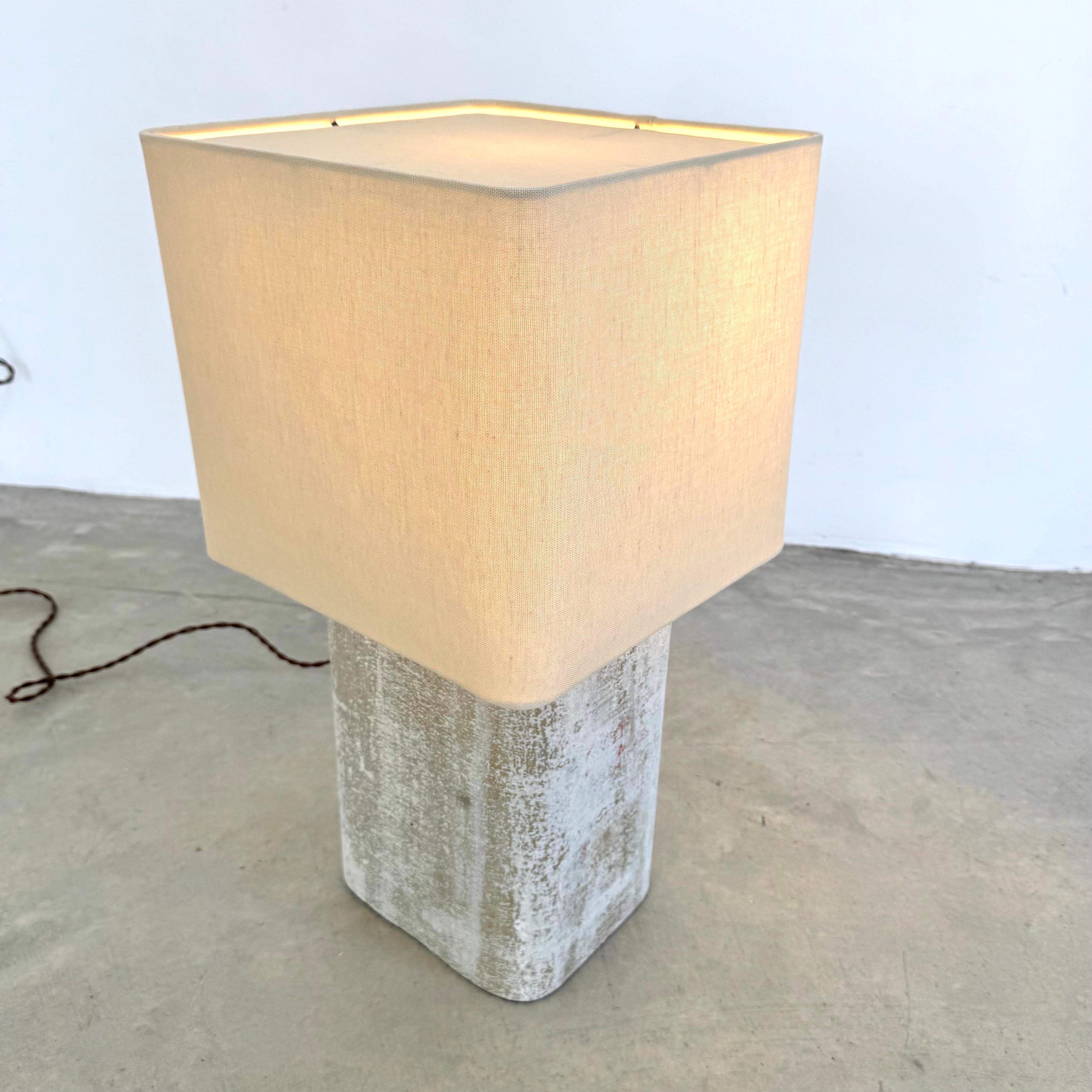 Stunning concrete Willy Guhl lamp by Eternit. Concrete made in Swizterland. Newly fitted as a lamp, re-wired with a new custom linen shade with rounded edges and light diffusor on top. Stunning simplicity and beautiful texture make these lamps