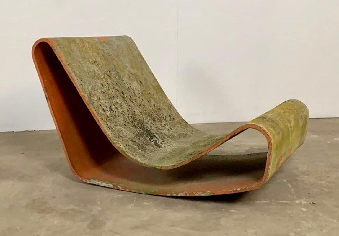 Architectural loop chair by Swiss designer Willy Guhl for Eternit. Iconic chair with beautiful patina. Great vintage condition with no cracks. Perfect for indoors or out. Single chair available with this patina.

Matching pairs of chairs available