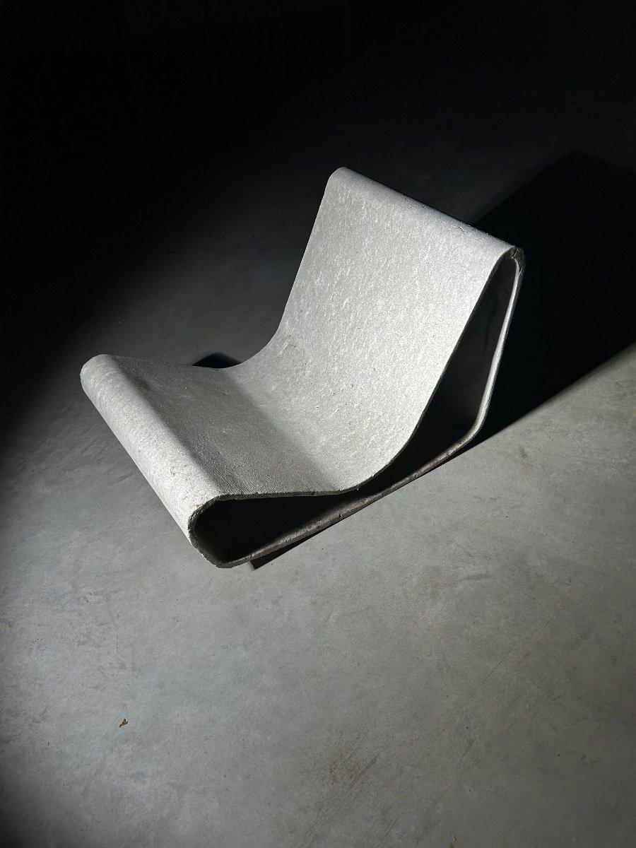 Two concrete chairs named 