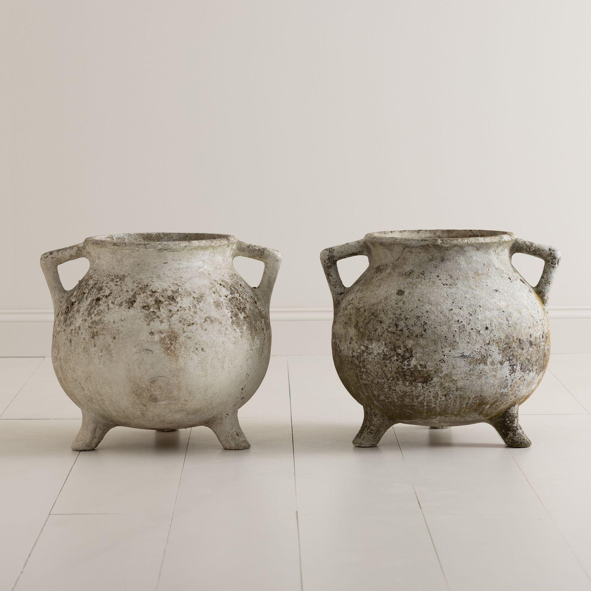 Footed planters with handles in the shape of cauldrons, known as the 'Marmite' model by Swiss designer Willy Guhl. These beautifully weathered planters were produced by Eternit in the 1950s - 1960s. Made of fiber cement, a durable and lightweight