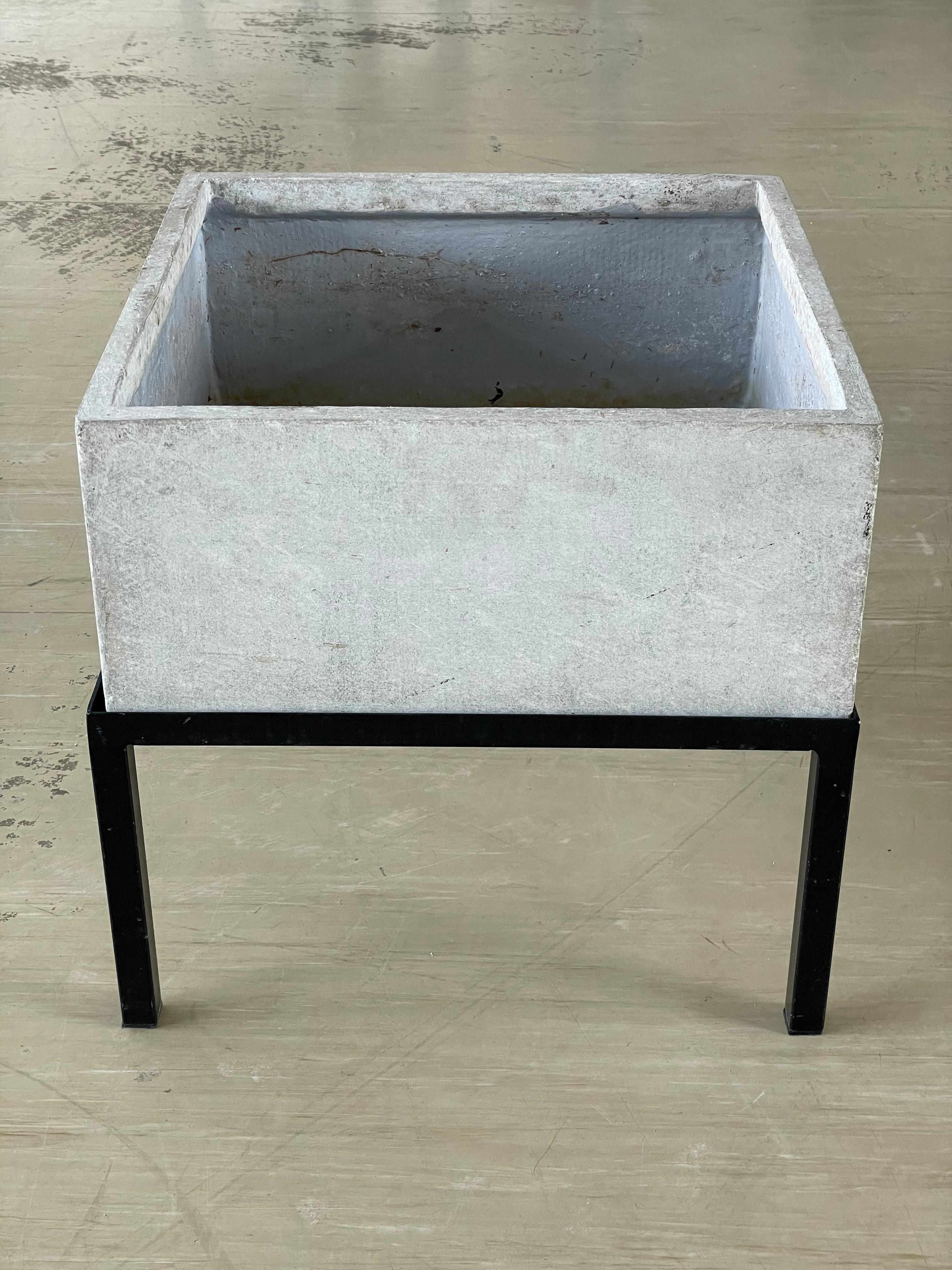 Rare Mid Century Swiss minimalist planter with original powder coated steel base. Designed by Willy Guhl and produced by Eternit AG, Switzerland, 1960’s. This item has never been used outdoors and remains in near perfect original condition. Sealed