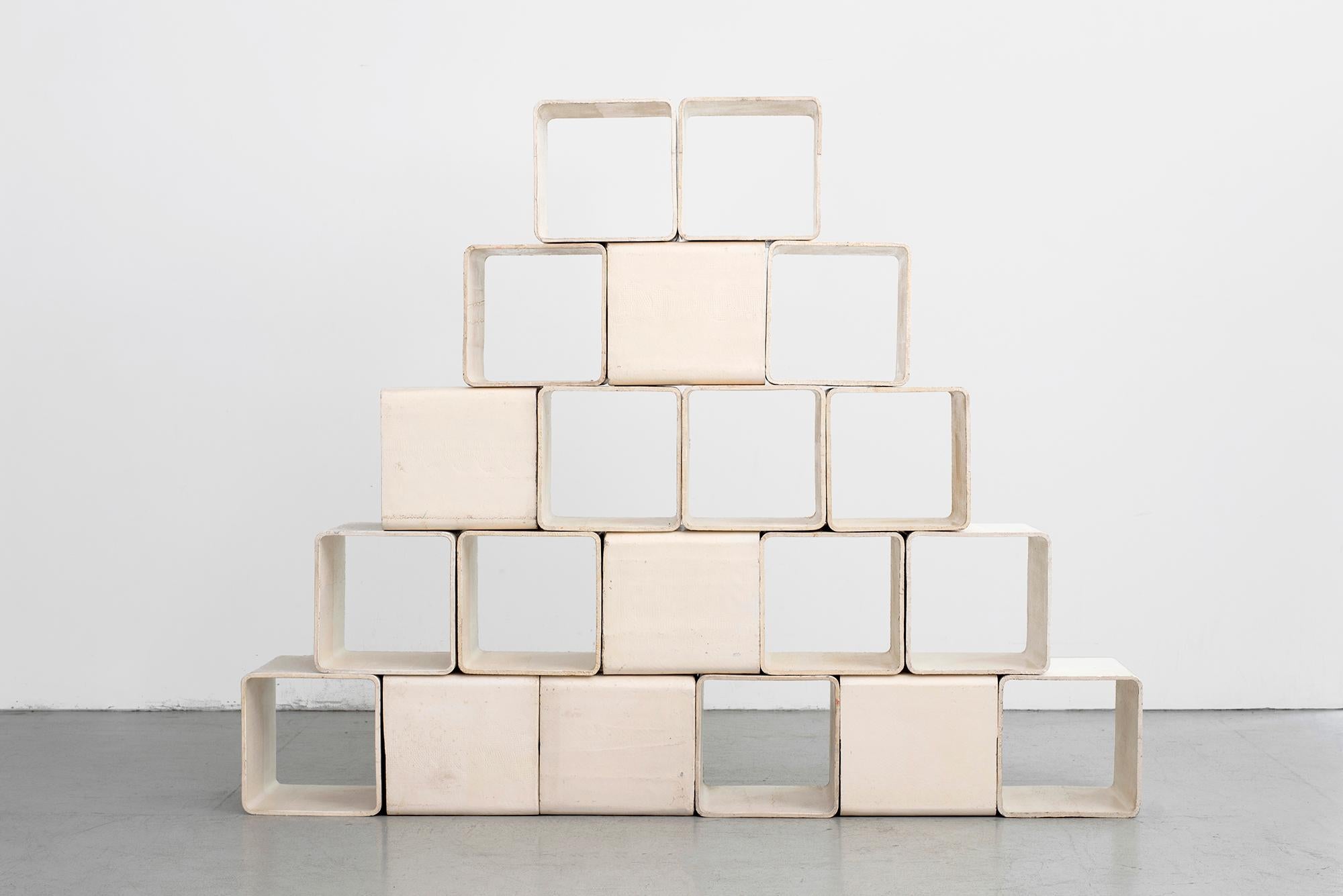 Rare large set of cement and fiber modular shelving cubes by Swiss Architect Willy Guhl. 
Each cement cube is freestanding and light weight and can be arranged in multiple ways. 
Original white finish with varying patina. 
Would make an
