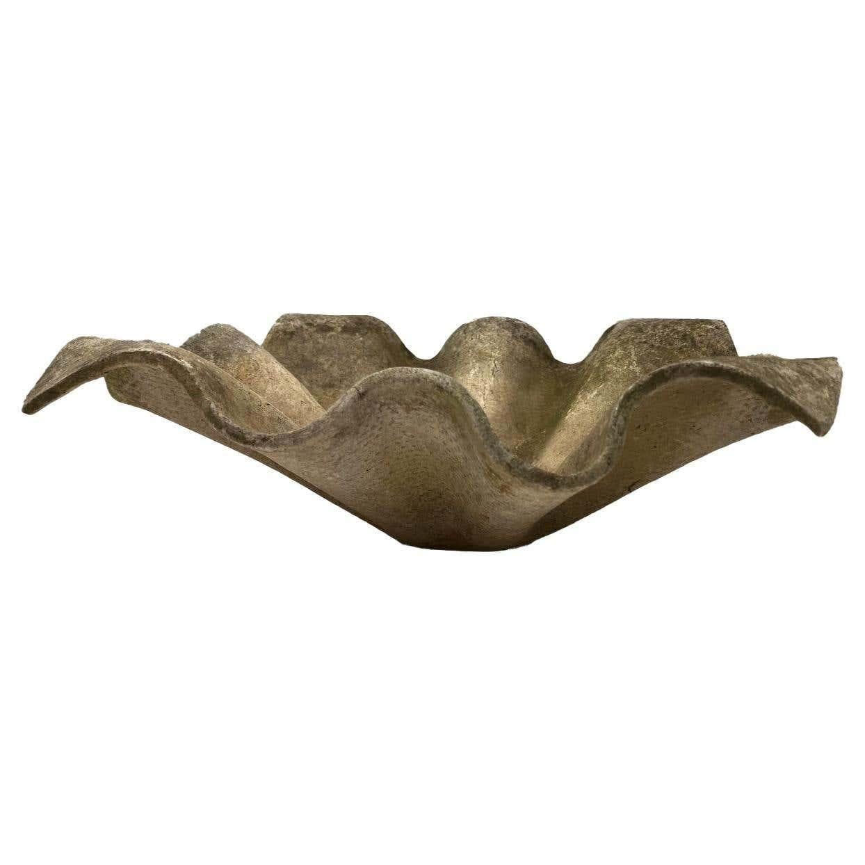 Willy Guhl was a famous Swiss designer who created planters in many shapes. These are formed from a slab of Eternit (a fibrous concrete material) that was molded into a handkerchief shape.