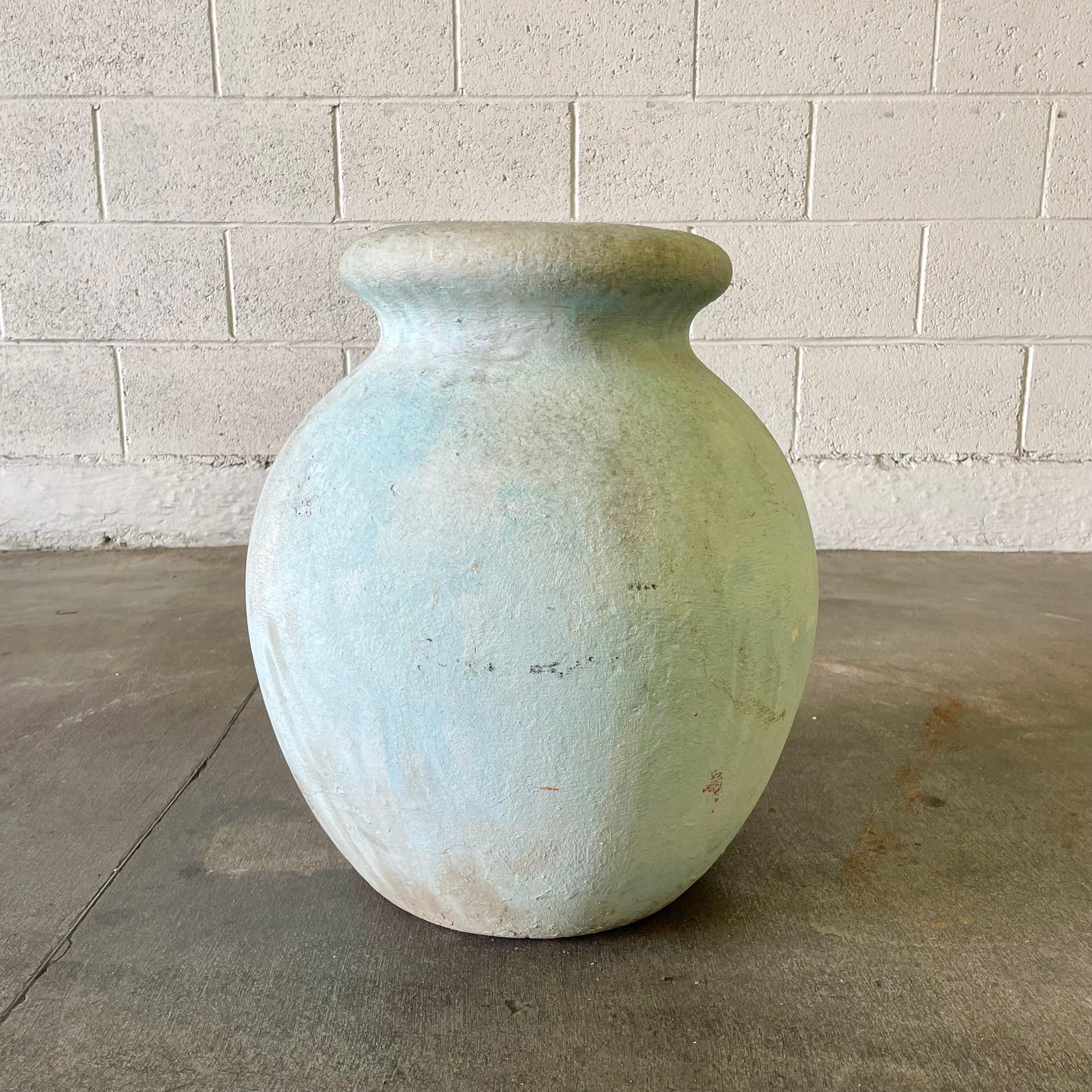 Concrete olive jar planter by Willy Guhl, with great patina and prominent presence. Beautiful pastel blue patina. Simple and elegant design perfect for any garden or patio. Excellent vintage condition. 

Mouth opening measures 8.5