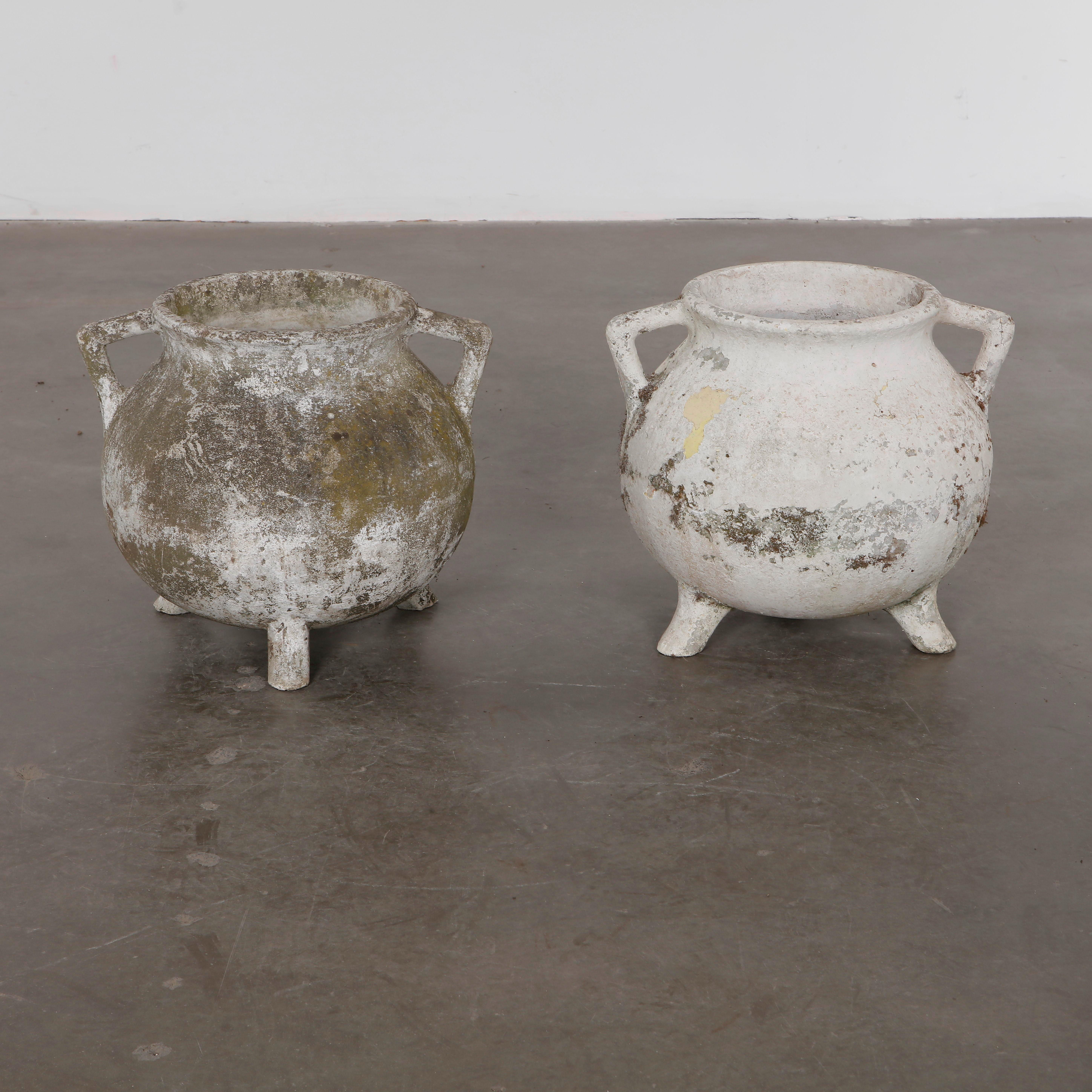 Rare cauldron planters by Willy Guhl, with rounded vessel-like shapes and strong sculptural presence. Aged surface adds rustic charm. 

Opening Diameter: 11.5 in. Overall Diameter: 21 in. Height: 18 in.