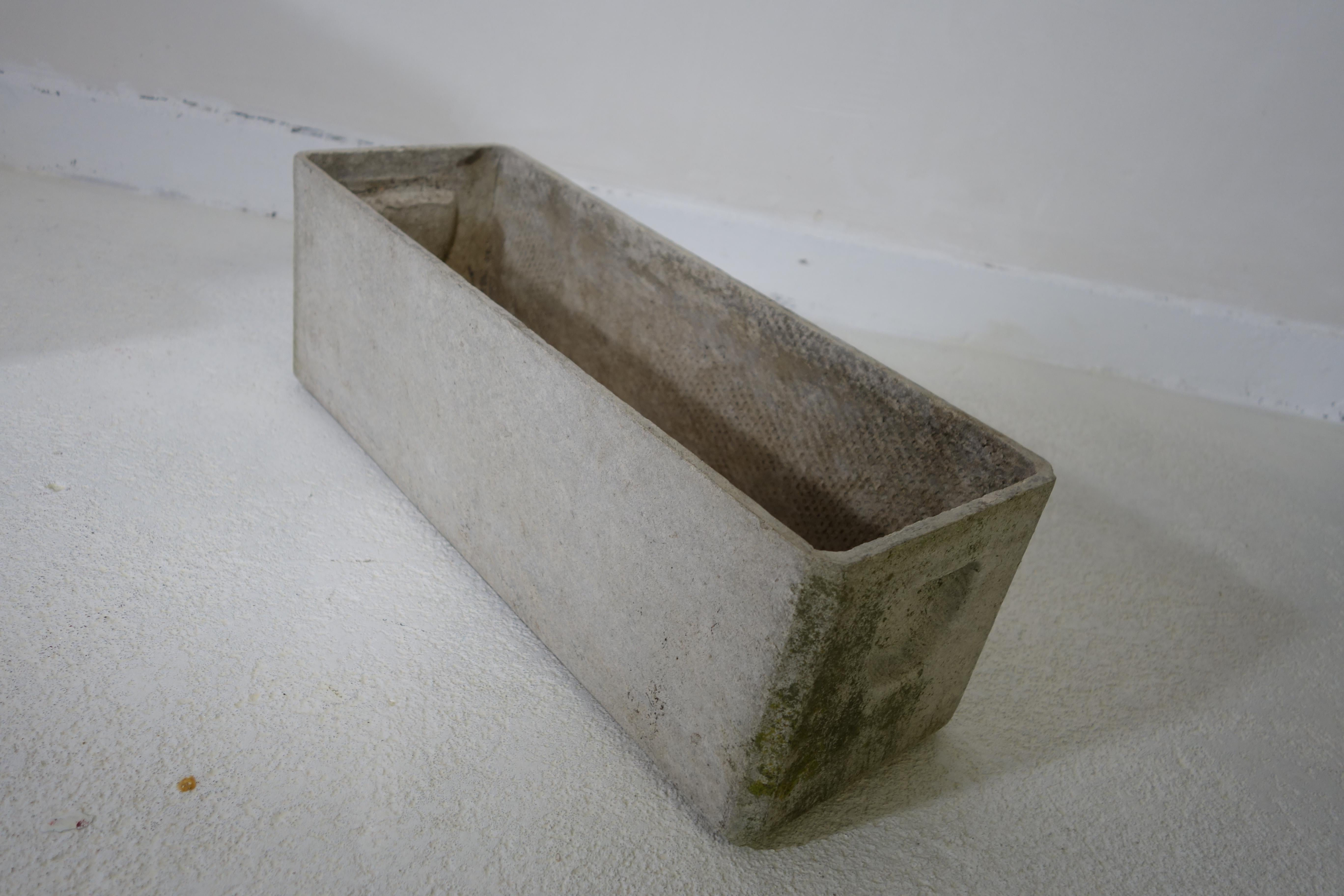 Rectangular planters designed by Swiss architect Willy Guhl for Eternit.
The planters are made of moulded cement. The holes in its bottom allow for water drainage.
These planters are in good vintage condition with a nice patina.