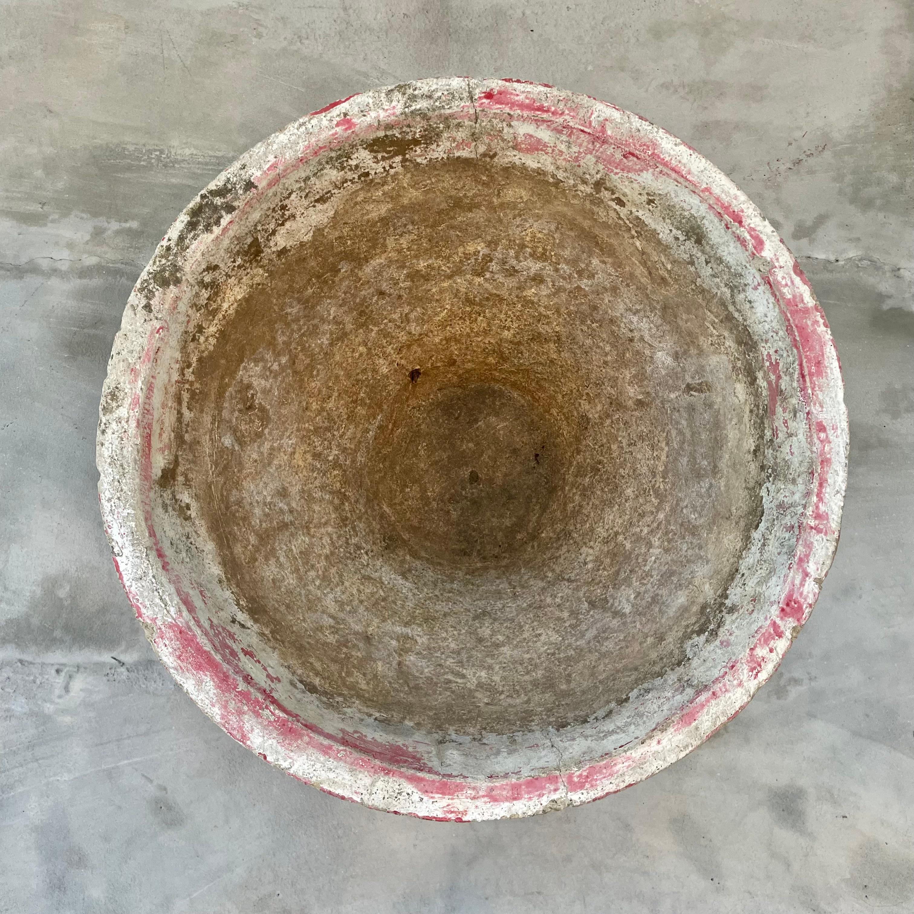 Concrete cone flower pot by Swiss architect and industrial designer Willy Guhl. Made in the 1960s in Switzerland. Beautifully faded dusty red patina across the whole outer body of the planter. Factory drilled drainage hole in the base.