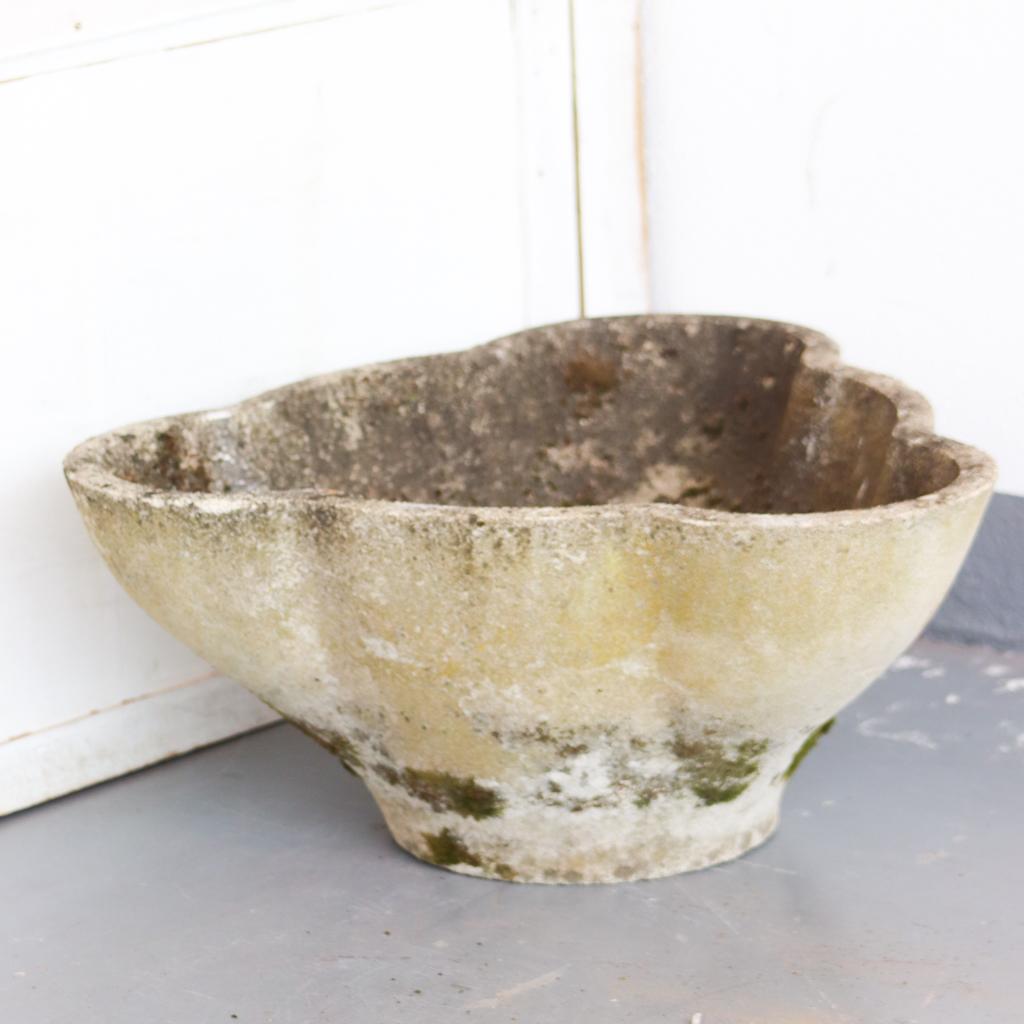 Large unusual scalloped concrete planters by Swiss architect Willy Guhl. Three rounded edges on all sides. Moss and lichen still present, with great patina. Two available. Very heavy.