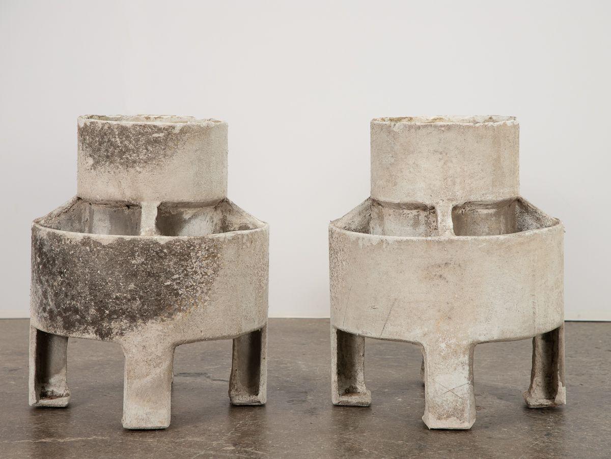 Pair of architectural elements, designed by Willy Guhl for Eternit. Originally used as vents, they can be repurposed as attractive planters. Made from cast cement that is strong and durable. Weathered surface has lovely patina from age. Available