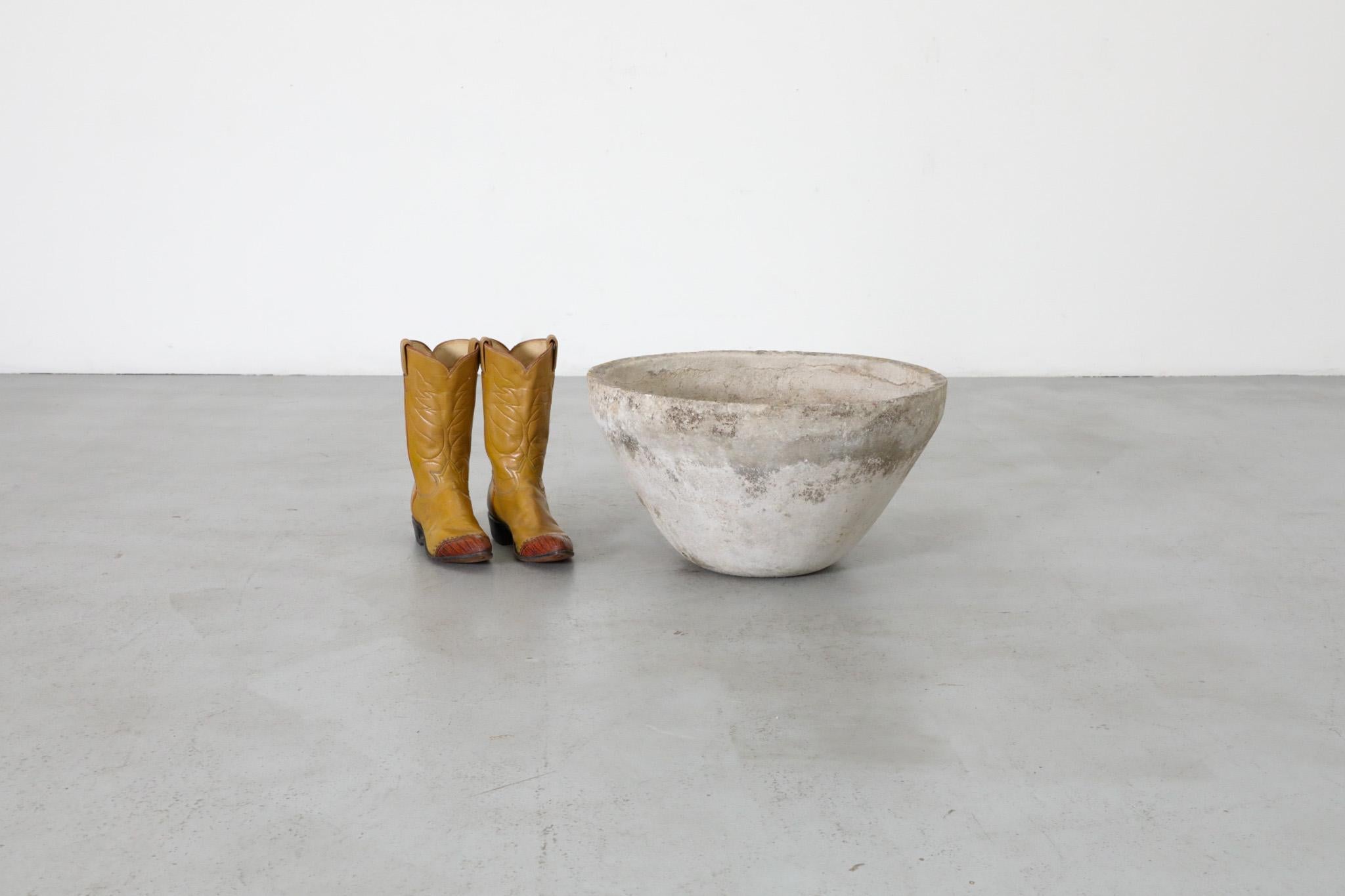 Stunning Mid-Century conical flower pot in the style of design luminary Willy Guhl. The planter's tapered design features drainage openings at the bottom, and the material has developed a stunning patina from years of exposure to the elements.