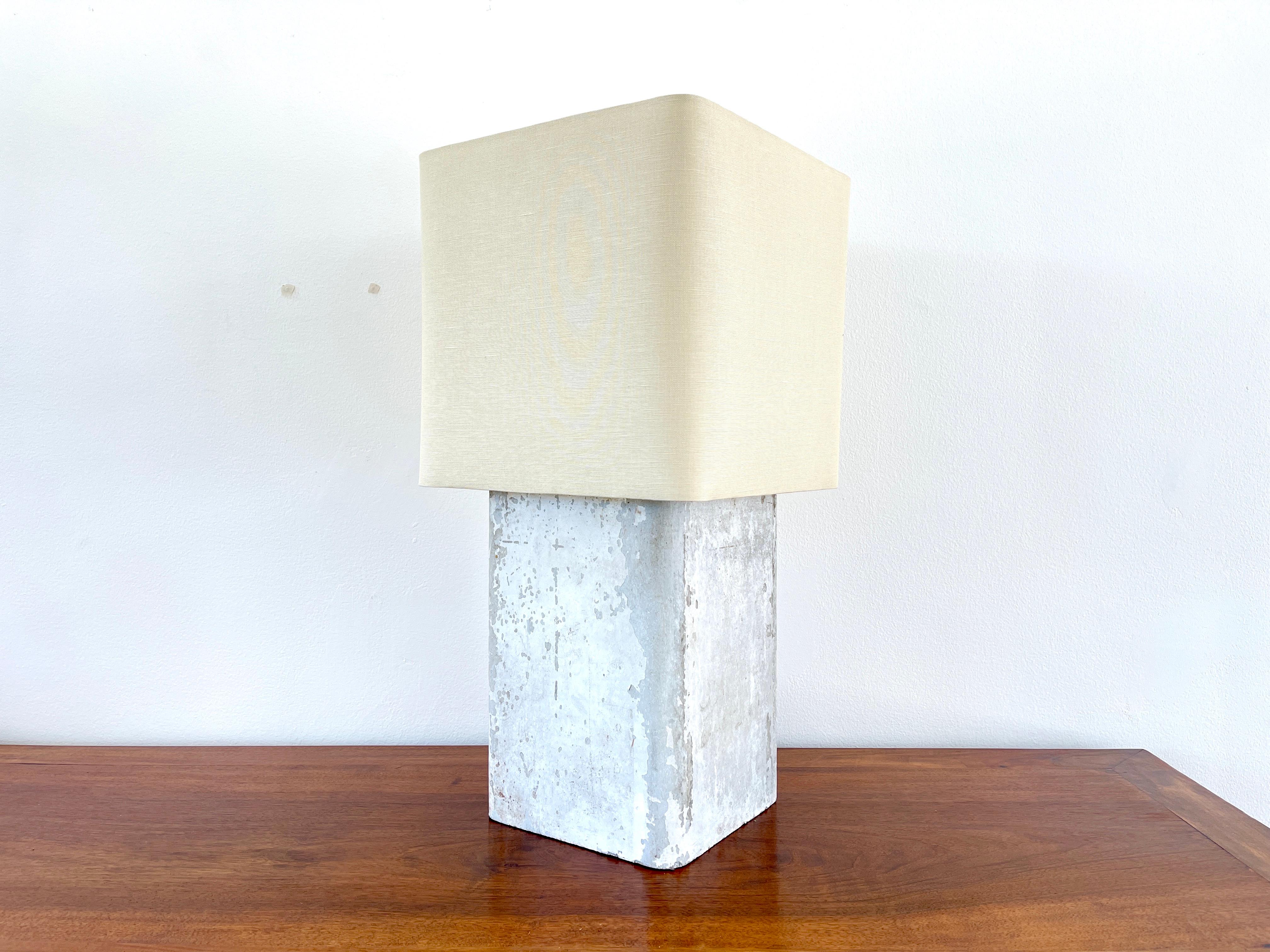 Willy Guhl concrete table lamp with linen shade 
Priced individually.

Measures: H - 24.25