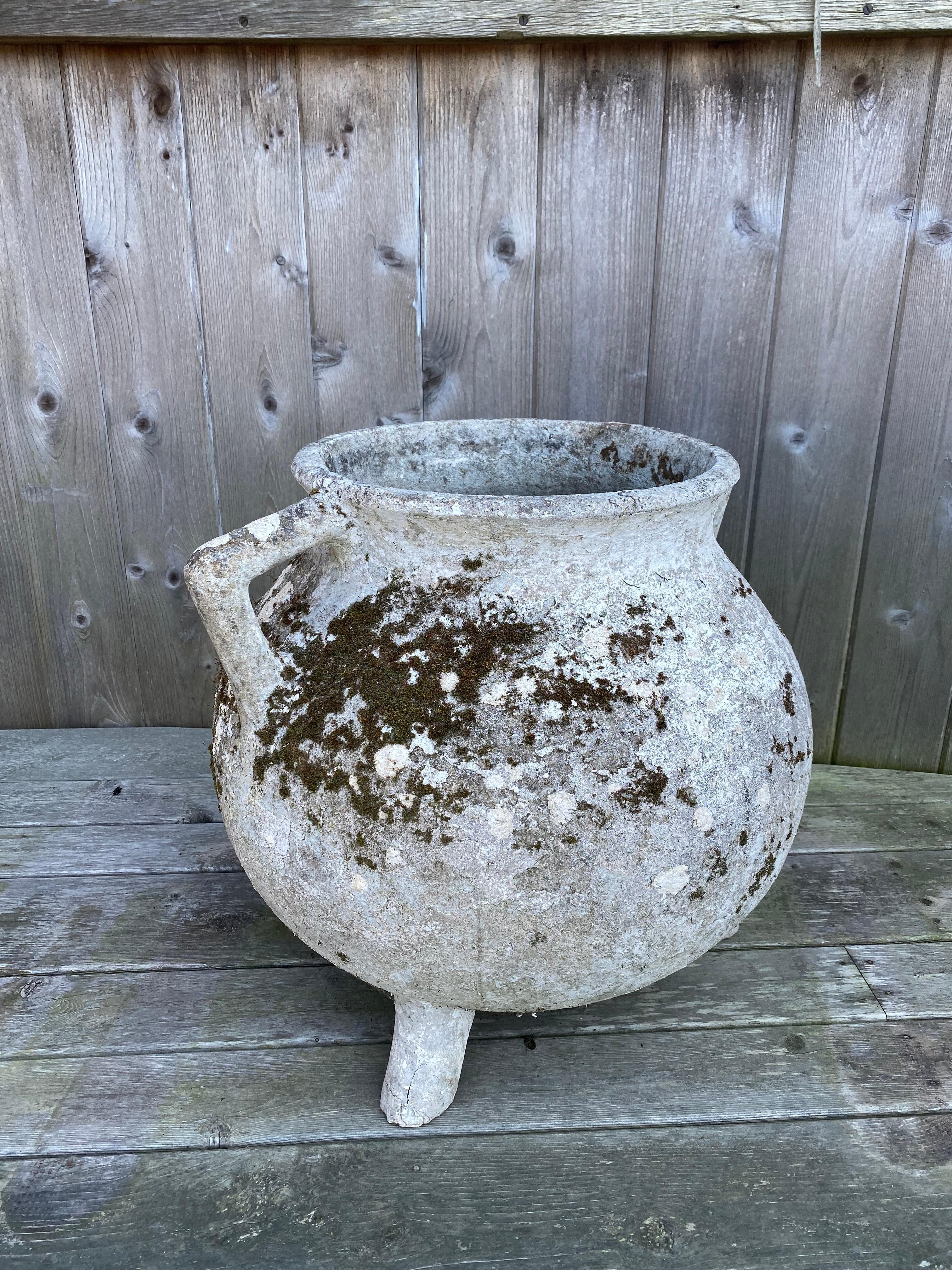 Willy Guhl Cauldron, or urn, planter. Both handles are fully intact and secure. Beautiful decay of a 70+ year life accented with natural moss growth.

One foot has minor cracking but does not affect structure in any way.

3 holes for draining.