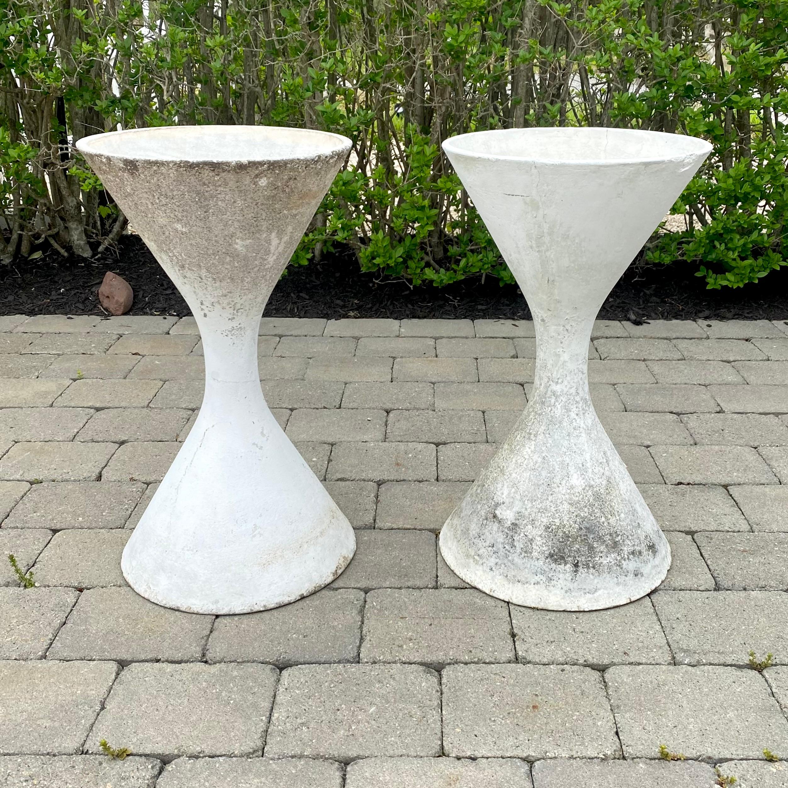 Classic white 'Diablo' hourglass planters by Swiss designer Willy Guhl for Eternit. Gorgeous gradient patina to white paint revealing the mottled cement beneath. Excellent vintage condition. Multiple other hourglass planters in various colors and
