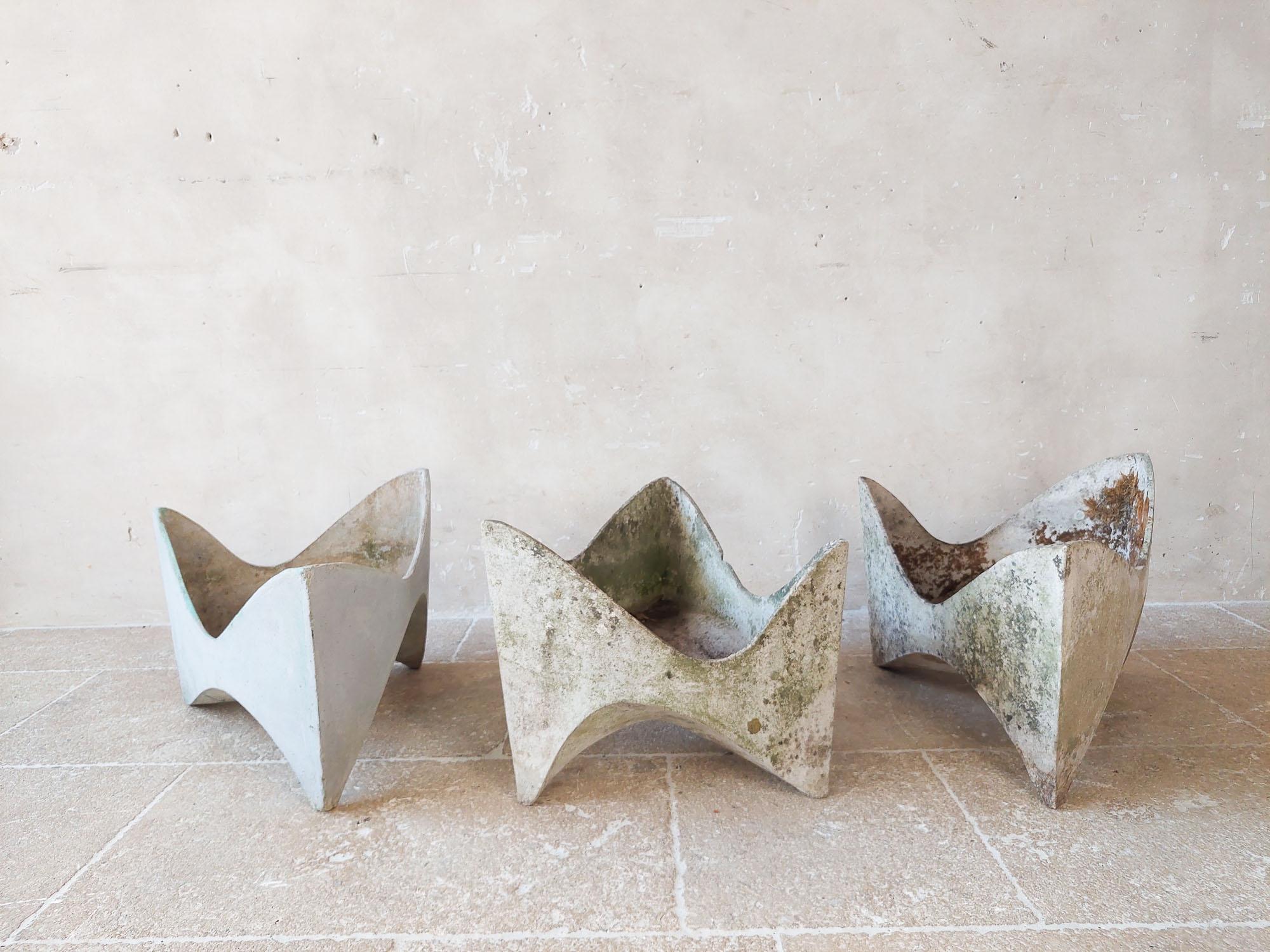 Beautifully shaped triangular Tooth planter by Swiss architect Willy Guhl.  (three available, price per piece).

Made from fiber cement, the planters are lightweight and durable in all climates. These sculptural planters have a beautifully weathered