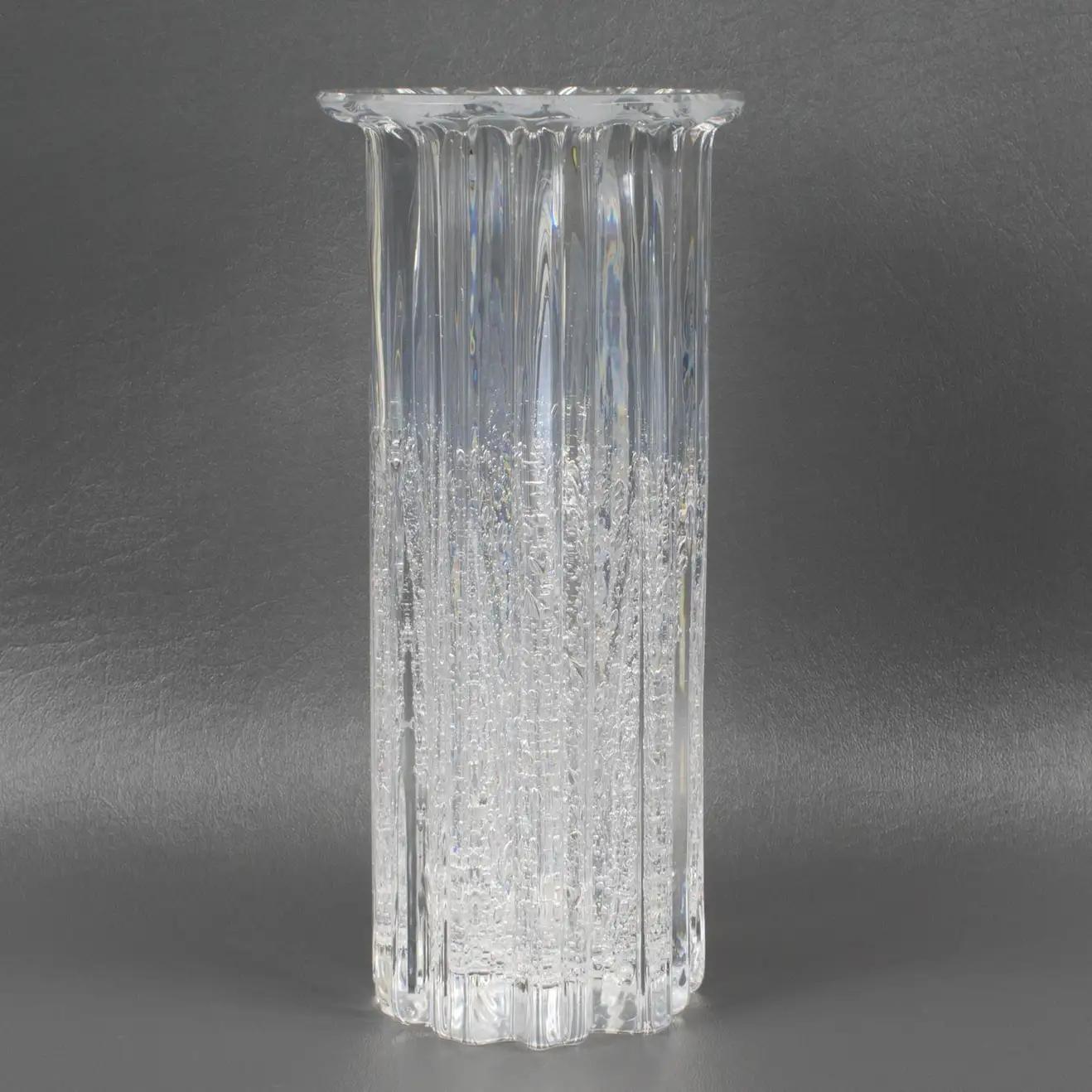 This beautiful art glass vase was designed by Willy Johansson (1921 - 1993) for Hadeland Glassverk, Norway. It is smooth to the touch, but the appearance looks heavily textured with ribs and bubbles trapped in glass. From the Atlantic series, this