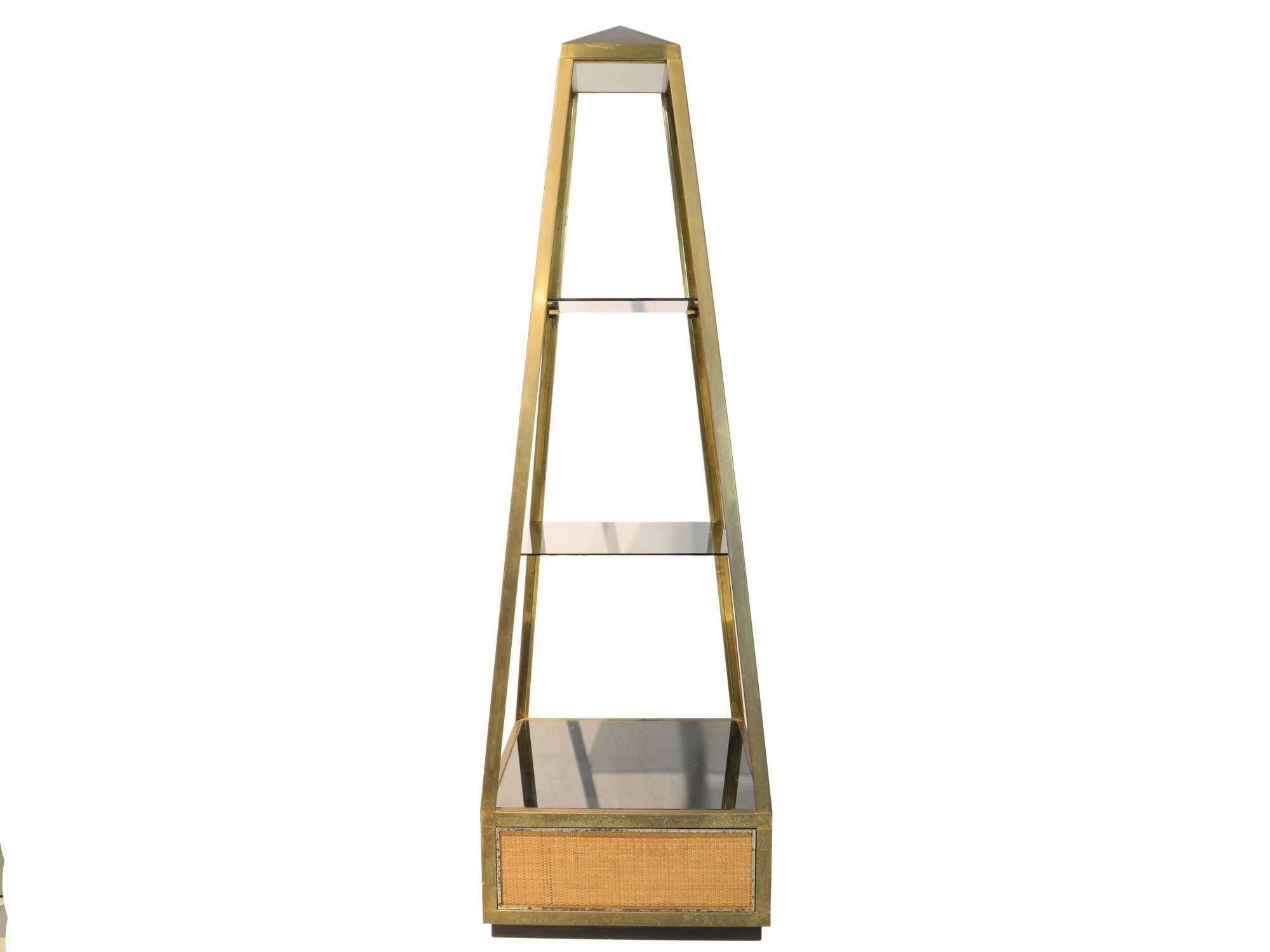 Willy Rizzo
Pair of stand with obelisk shape
Made of brass, glass, straw details
One is electrified and has a lamp hidden in the top of the obelisk
The second one can be electrified on request
France, circa 1980.
 