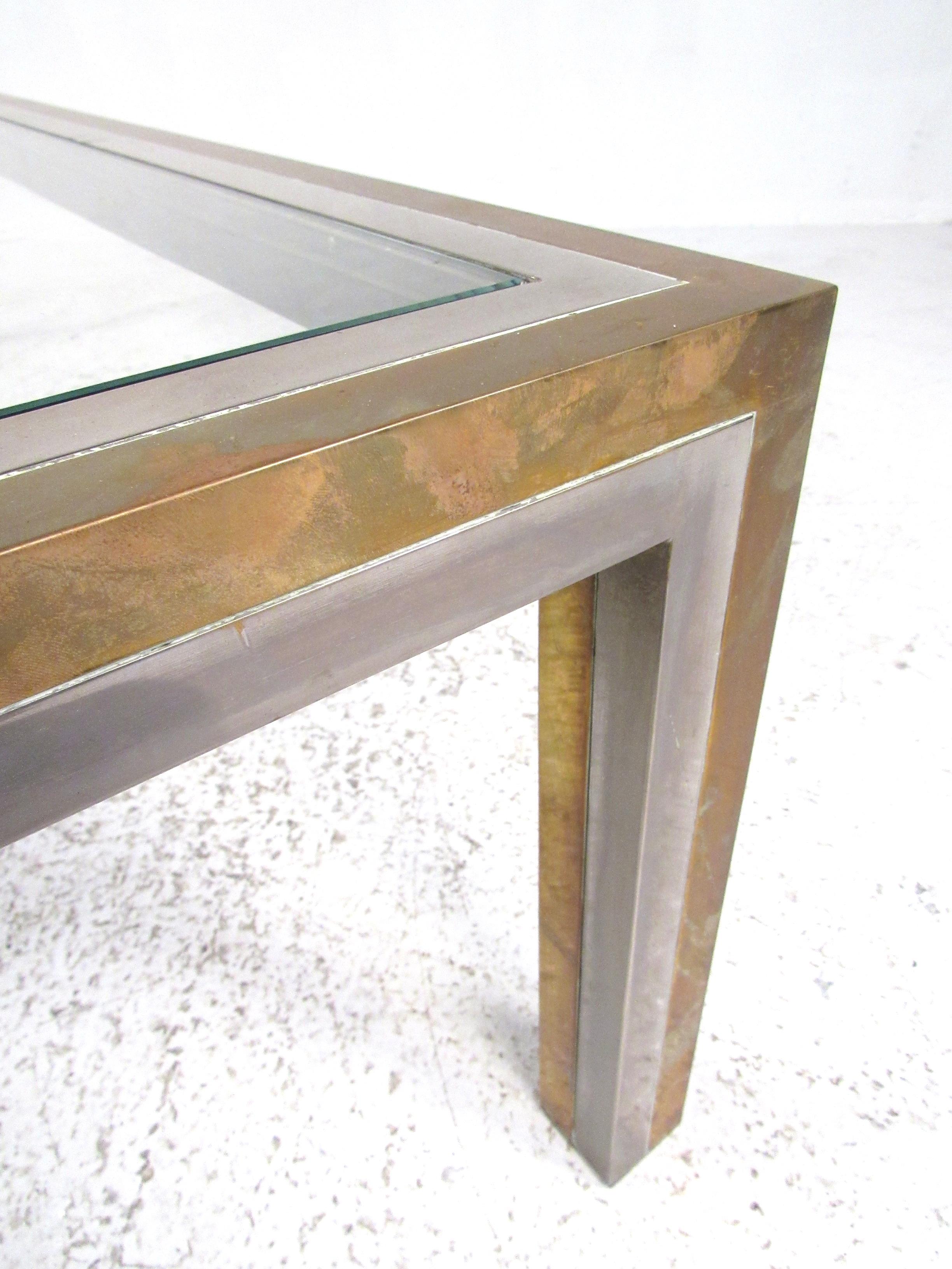 Nicely proportioned brass and chrome Regency style coffee table attributed to Willy Rizzo, circa 1970s. Please confirm item location (NY or NJ) with dealer.
 
